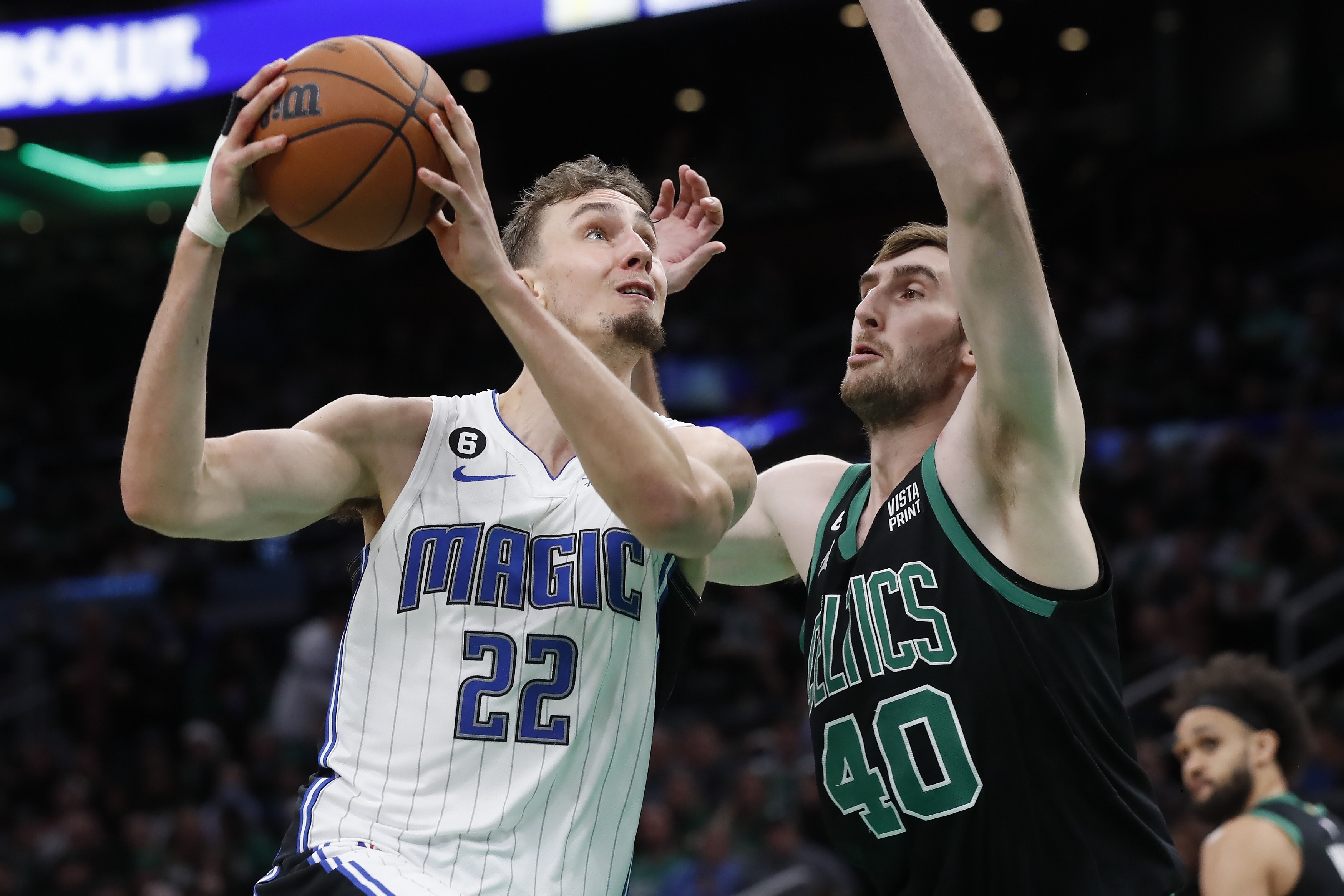 Orlando Magic's Franz Wagner (22) shoots against Boston Celtics' Luke Kornet (40) during the second half of an NBA basketball game, Friday, Dec. 16, 2022, in Boston.