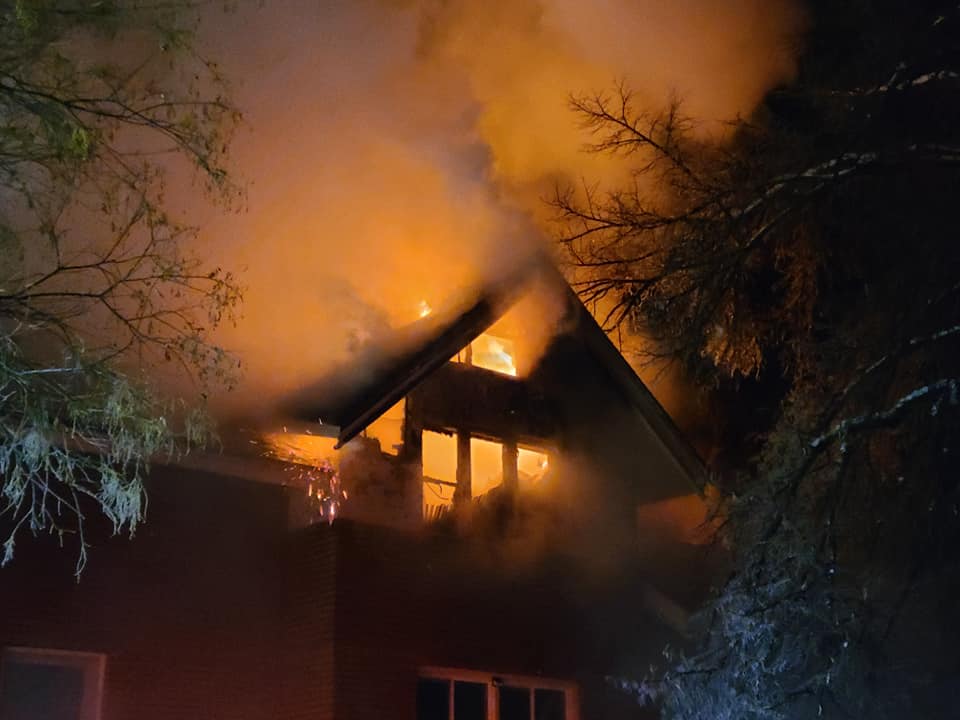 Firefighters with Logan Fire Department attempt to put out a fire just east of the Logan Tabernacle on Saturday.