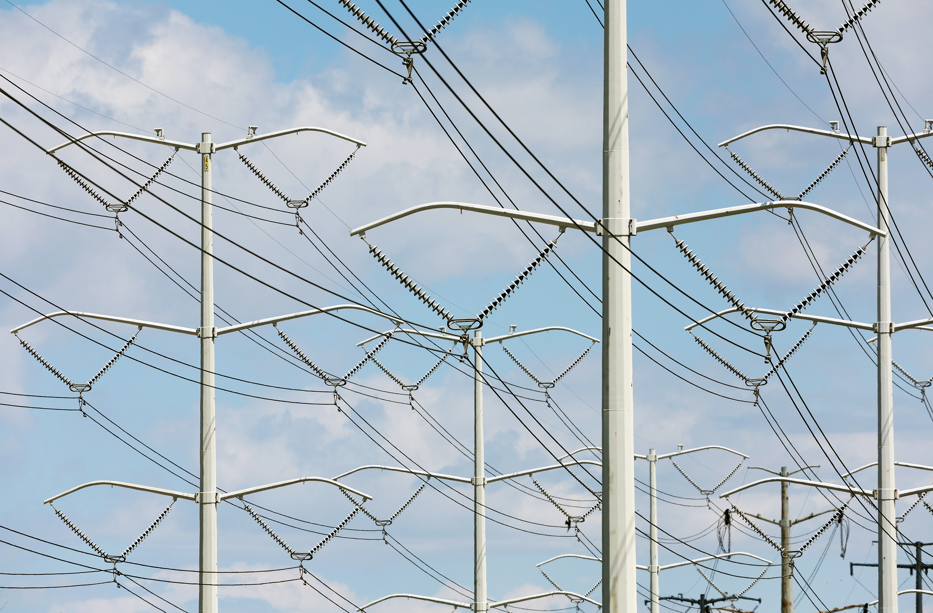 High-tension power lines run along Wright Brothers Drive on May 24, 2022.