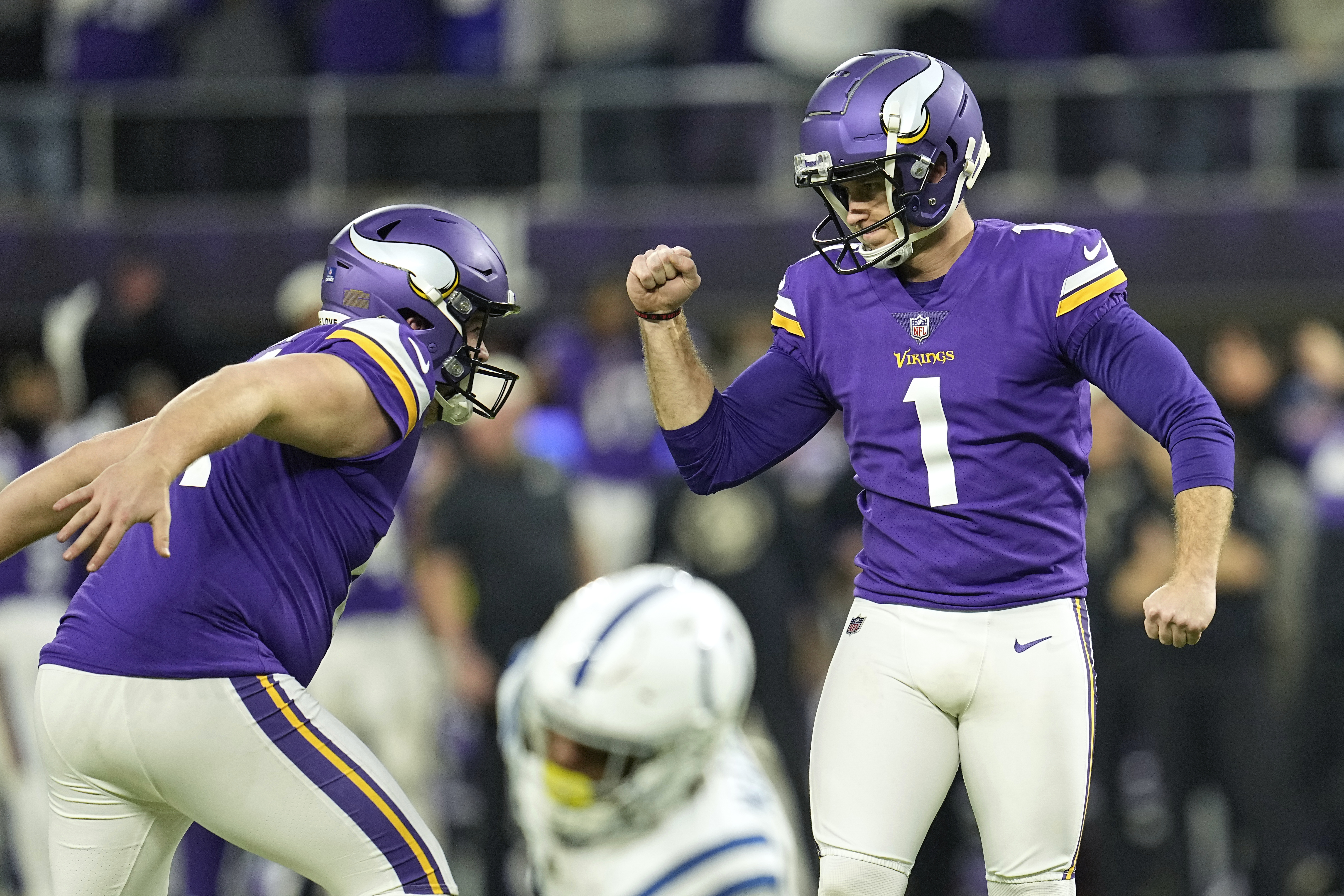 Minnesota Vikings place kicker Greg Joseph (1) celebrates after kicking a 40-yard field goal during overtime in an NFL football game against the Indianapolis Colts, Saturday, Dec. 17, 2022, in Minneapolis. The Vikings won 39-36