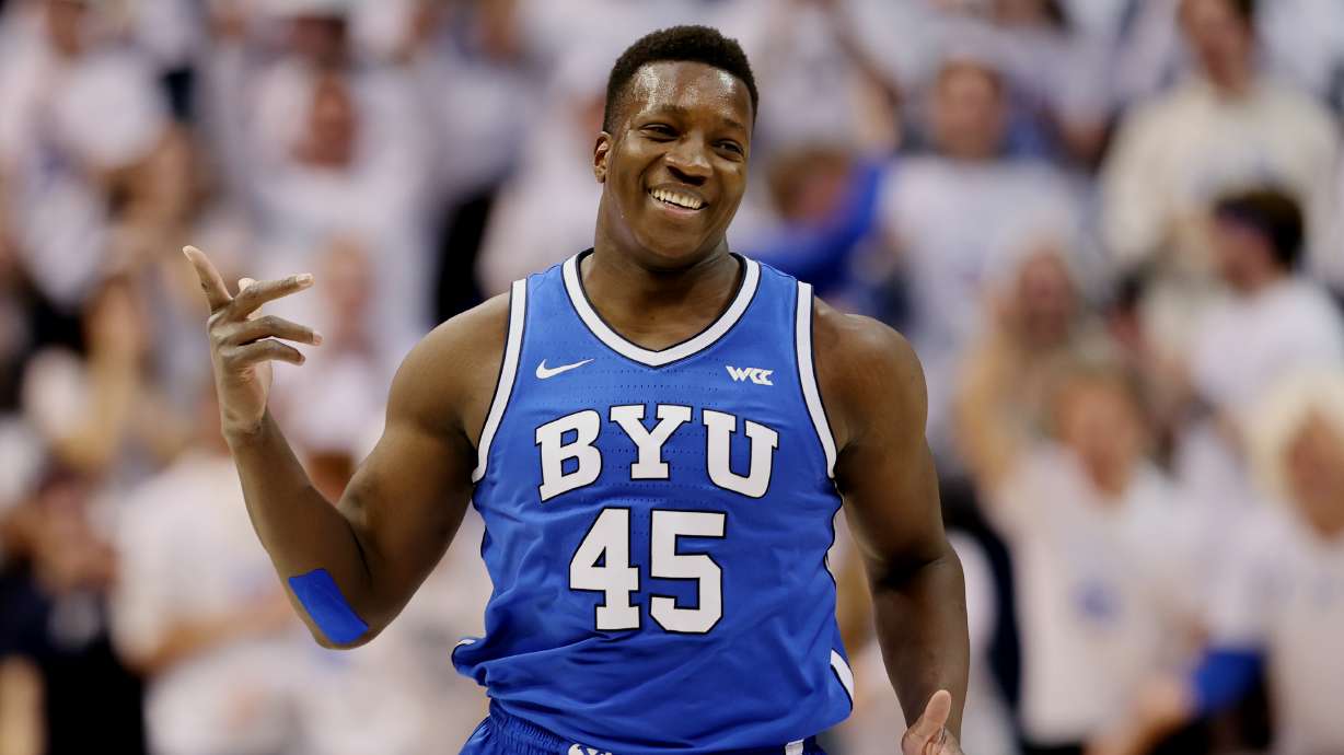 Brigham Young Cougars forward Fousseyni Traore (45) reacts after getting points from a deflected ball as BYU and Utah play at the Marriott Center in Provo on Saturday, Dec. 17, 2022.