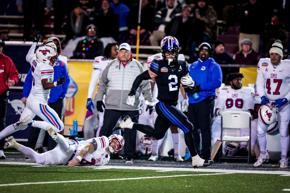 BYU linebacker Ben Bywater returns an interception 76 yards for a touchdown during the New Mexico Bowl, Saturday, Dec. 17, 2022 in Albuquerque, N.M.