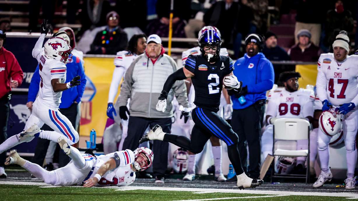 BYU linebacker Ben Bywater returns an interception 76 yards for a touchdown during the New Mexico Bowl, Saturday, Dec. 17, 2022 in Albuquerque, N.M.