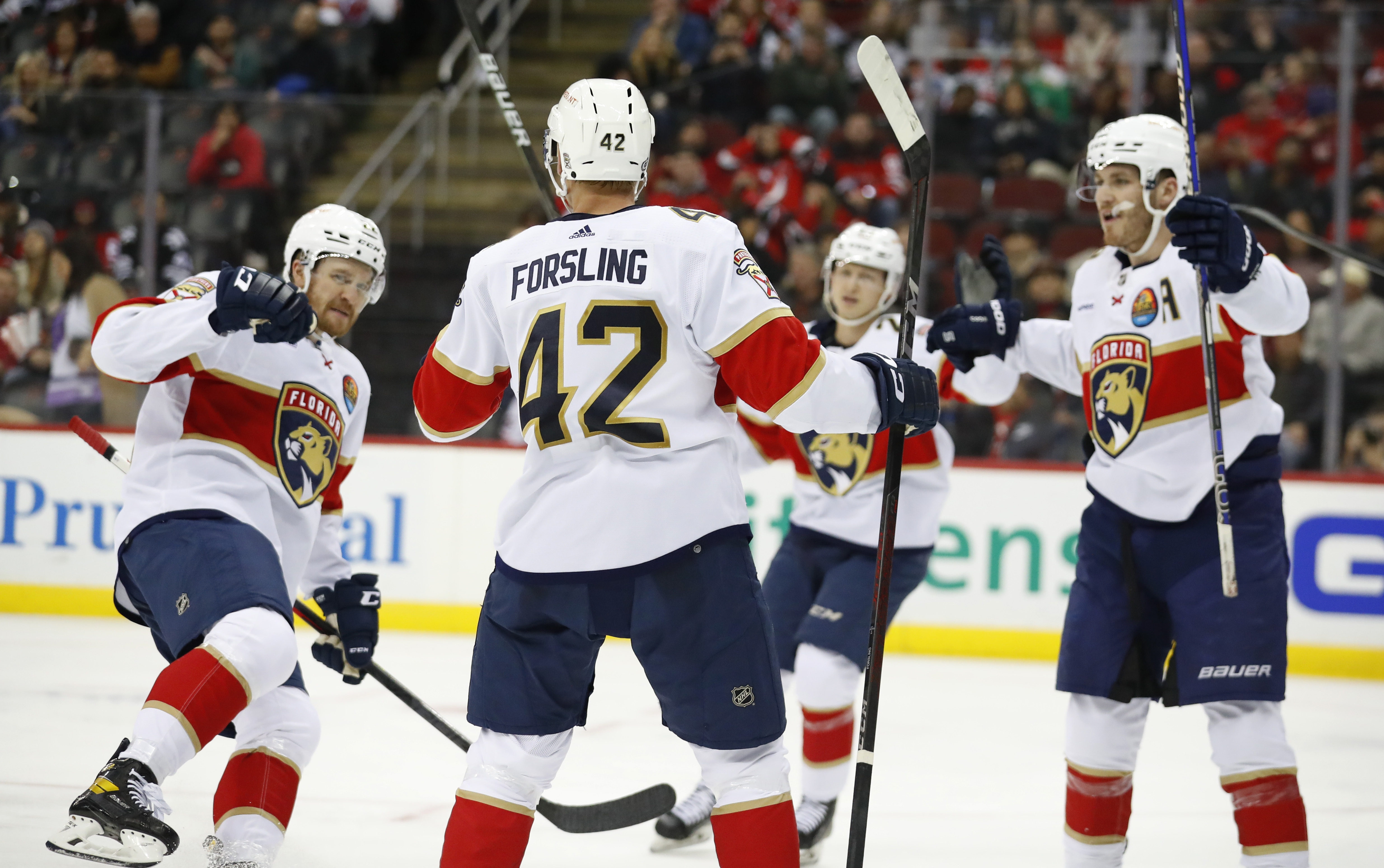 Florida Panthers defenseman Gustav Forsling (42) celebrates with teammates after scoring a goal against the New Jersey Devils during the second period of an NHL hockey game, Saturday Dec. 17, 2022, in Newark, N.J. 
