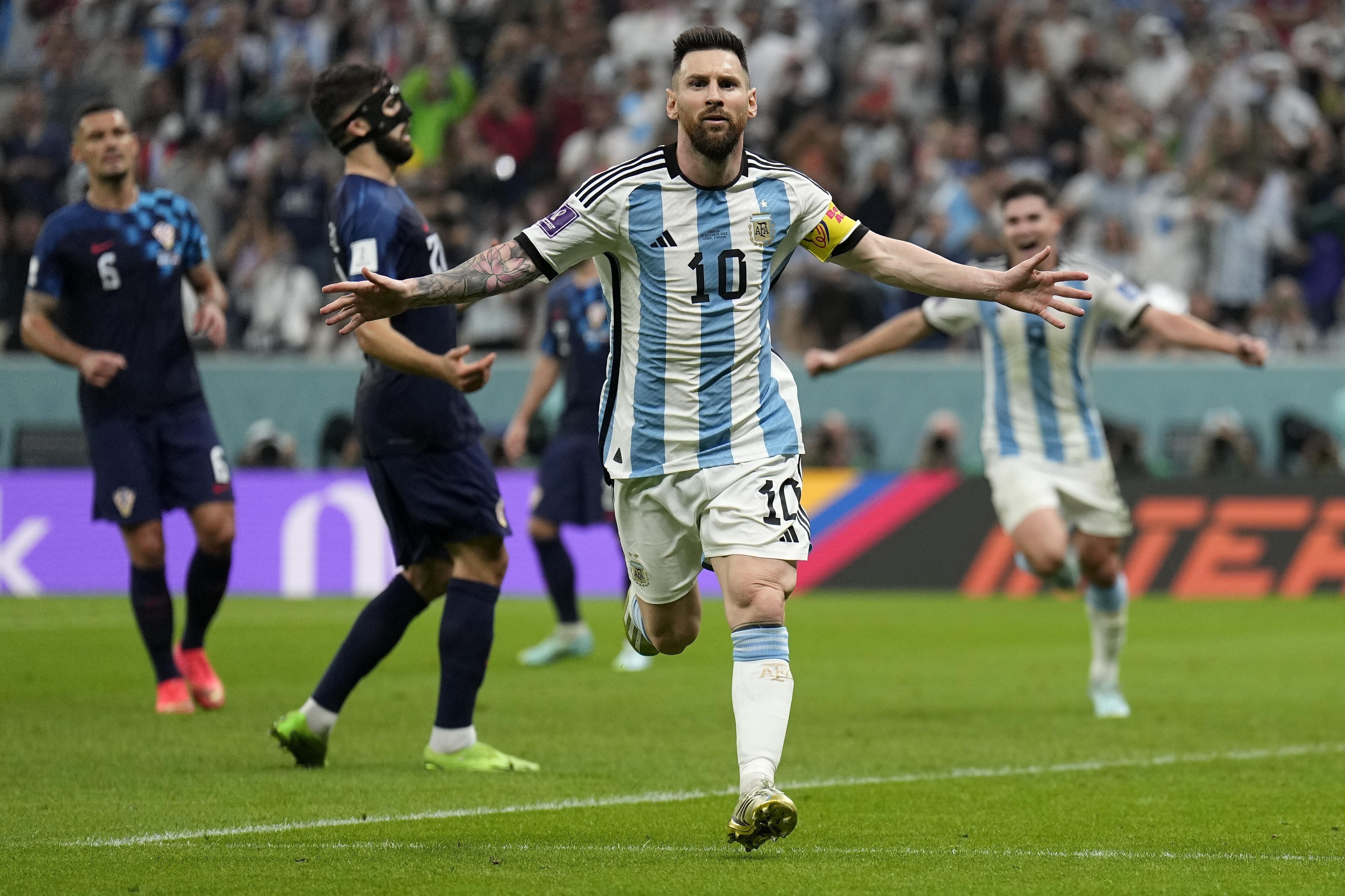 Argentina's Lionel Messi celebrates after scoring his side's first goal during the World Cup semifinal soccer match between Argentina and Croatia at the Lusail Stadium in Lusail, Qatar, Tuesday, Dec. 13, 2022.