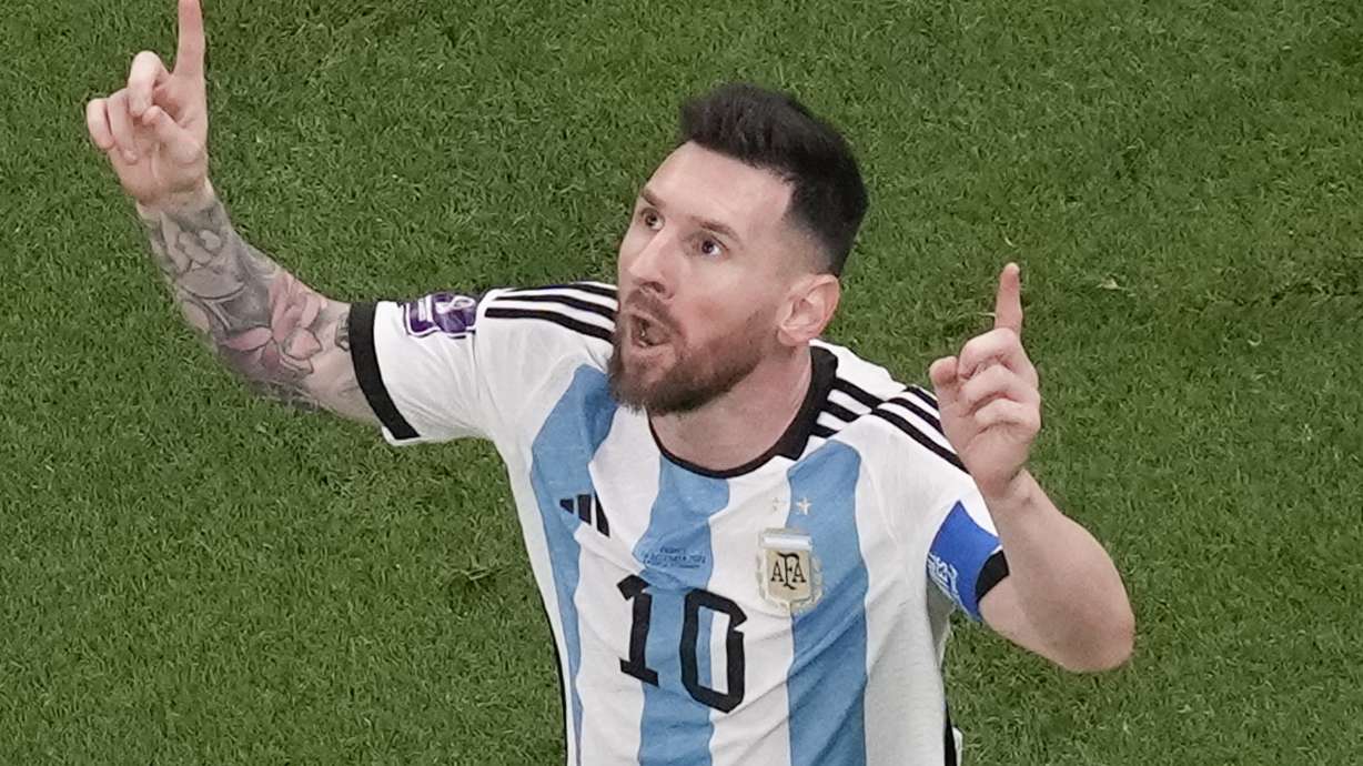 Argentina's Lionel Messi celebrates scoring his side's first goal during the World Cup final soccer match between Argentina and France at the Lusail Stadium in Lusail, Qatar, Sunday, Dec. 18, 2022.