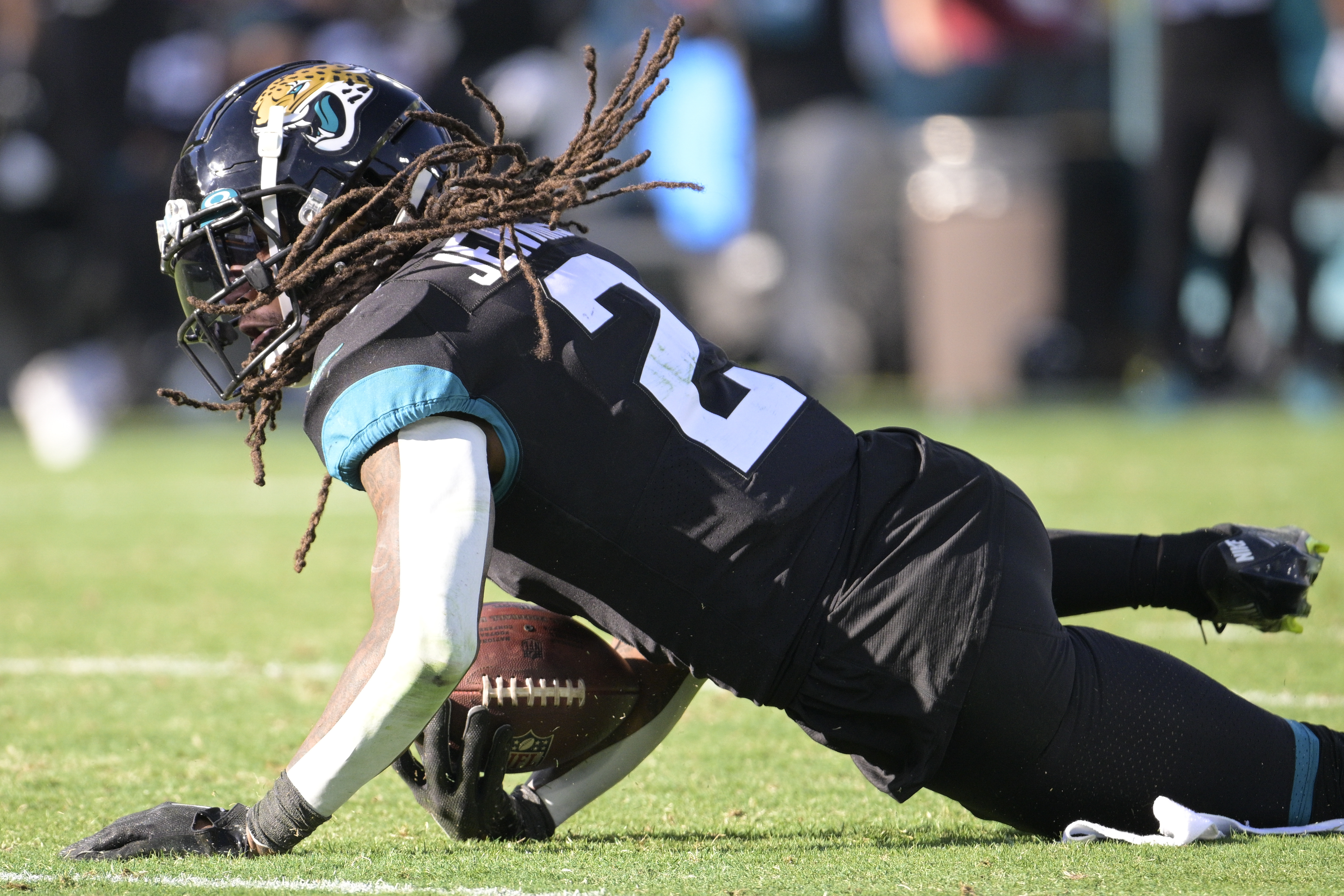 Jacksonville Jaguars safety Rayshawn Jenkins (2) intercepts a pass during the second half of an NFL football game against the Dallas Cowboys, Sunday, Dec. 18, 2022, in Jacksonville, Fla. 