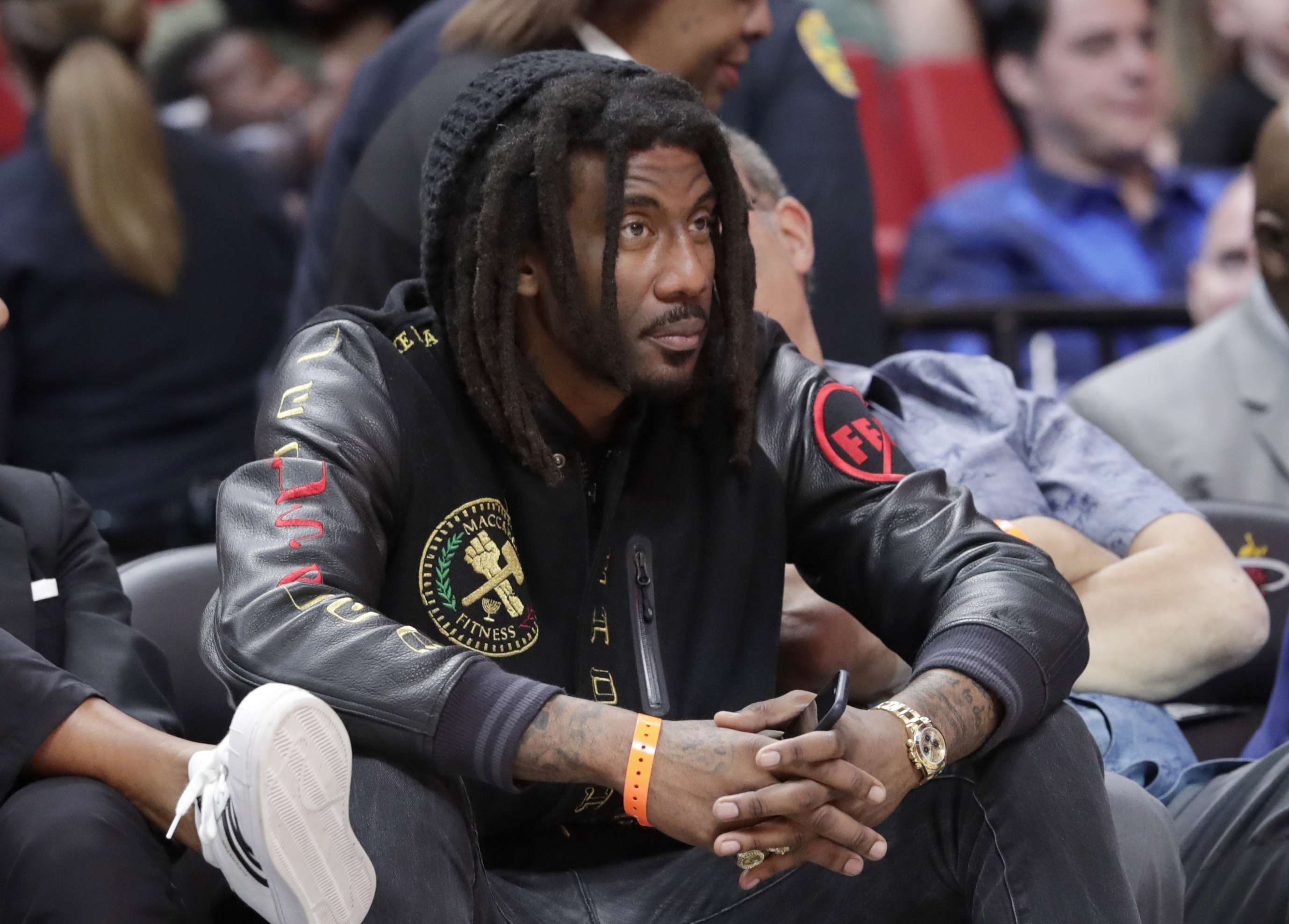 FILE - Former NBA basketball player Amar'e Stoudemire watches during the second half of an NBA basketball game between the Miami Heat and Sacramento Kings, Monday, Jan. 20, 2020, in Miami. Stoudemire is facing a misdemeanor battery charge after police say he punched his teenage daughter in the face. Court records show the former Phoenix Suns and New York Knicks star was arrested early Sunday, Dec. 18, 2022, and later released on $1,500 bond. 
