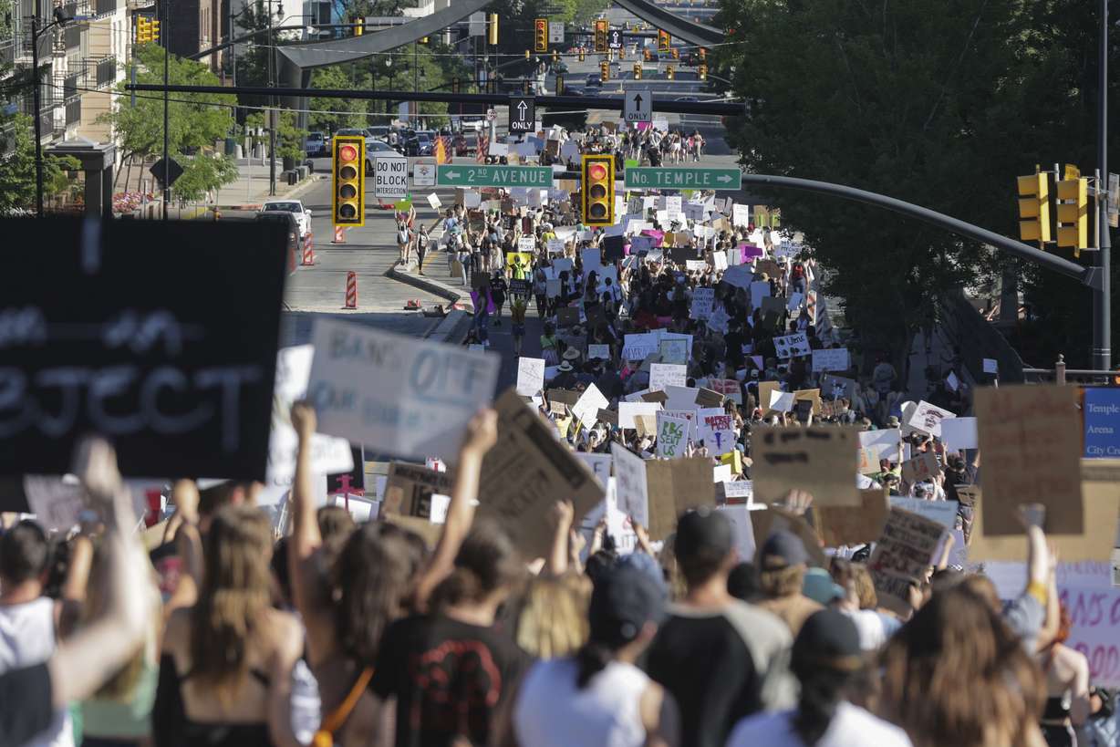 Hundreds of protesters walk from the Capitol to Washington Square Park in Salt Lake City on June 26, after the Supreme Court overturned Roe v. Wade.