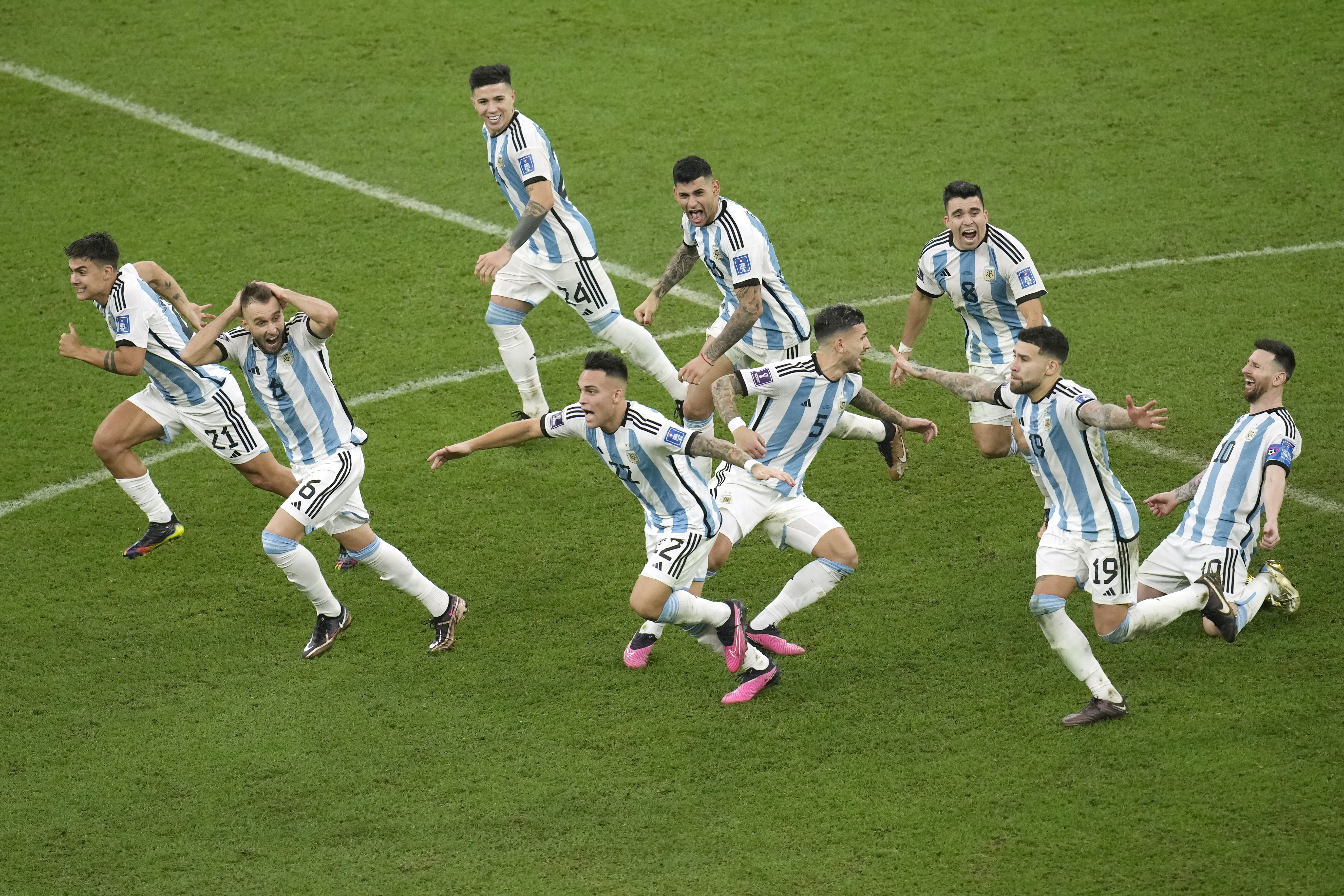 Argentina's players celebrate their victory at the end of the World Cup final soccer match between Argentina and France at the Lusail Stadium in Lusail, Qatar, Sunday, Dec. 18, 2022. 