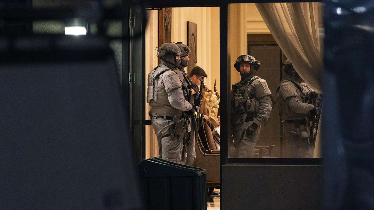 York Regional Police tactical officers stand in the lobby of a condominium in Vaughan, Ontario, Canada on Sunday. Five people and a suspect are dead after a shooting in the building, police said.