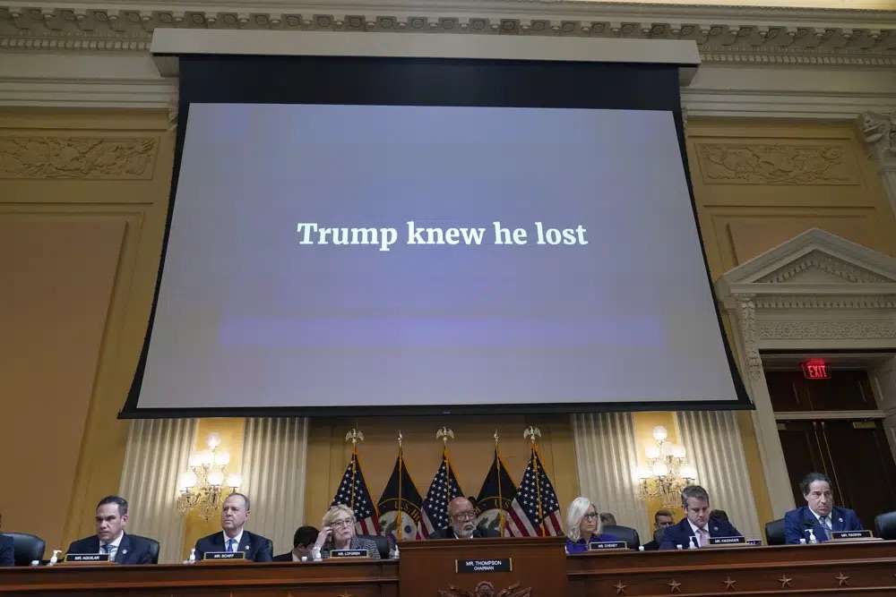 A video presentation plays as the House select committee investigating the Jan. 6 attack on the U.S. Capitol holds its final meeting on Capitol Hill in Washington, Monday.