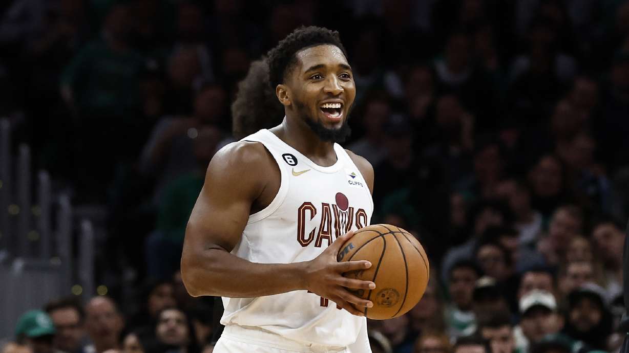 Cleveland Cavaliers' Donovan Mitchell smiles at teammates during the second half of an NBA basketball game against the Boston Celtics Friday, Oct. 28, 2022, in Boston.