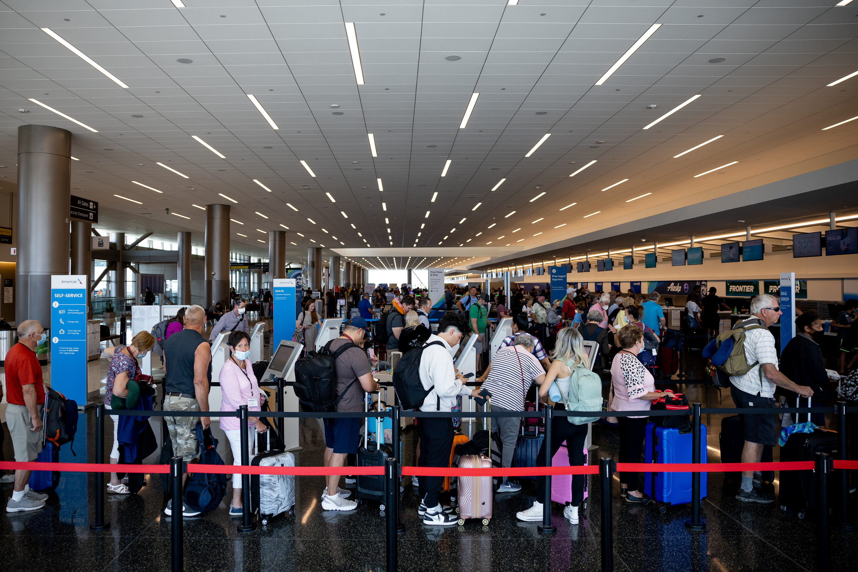 People check bags at Salt Lake City International Airport in Salt Lake City on July 1, 2022. The airport welcomed a record 26.4 million passengers during the 2023 fiscal year, and the airport is also on track to set a new calendar year record.