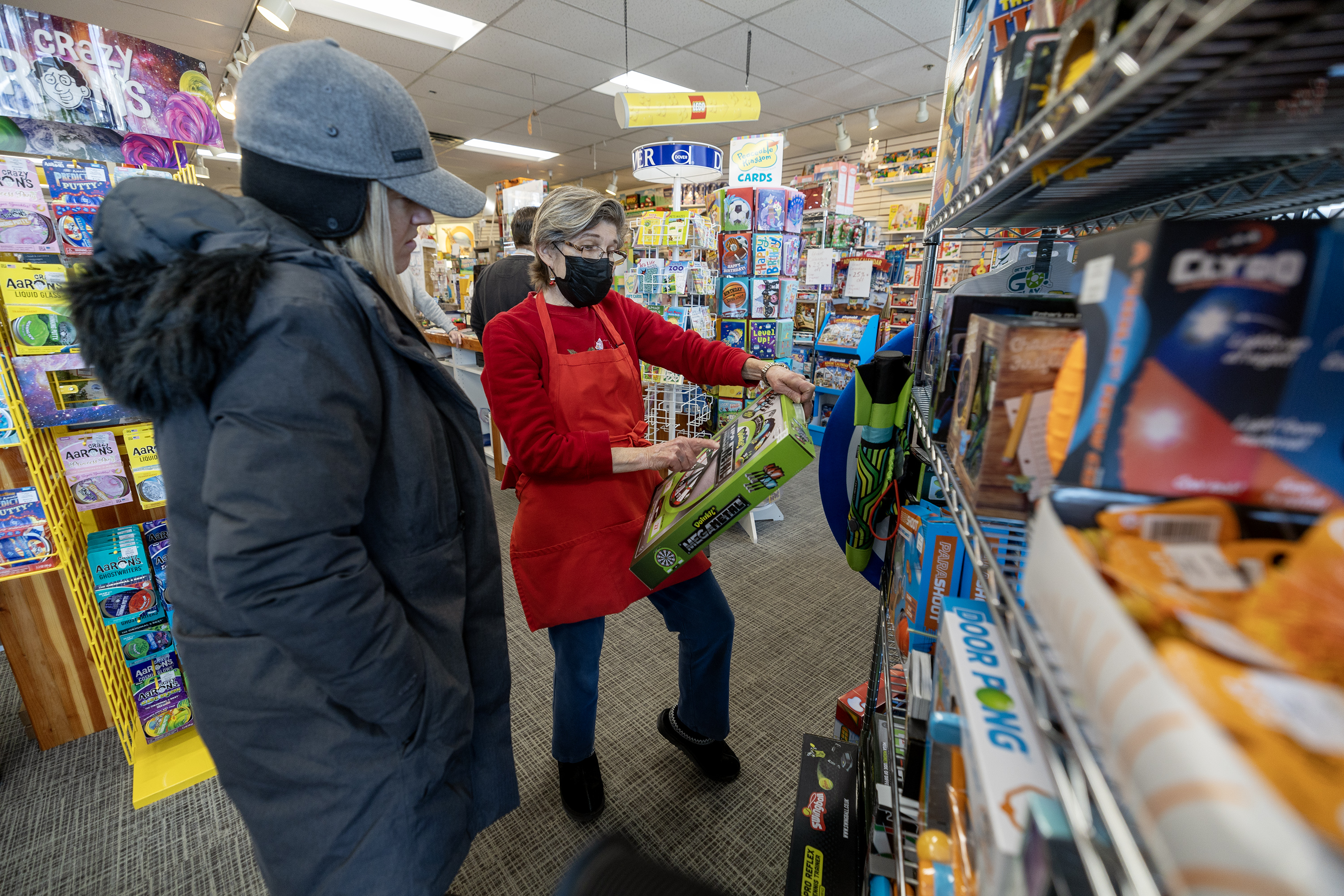 Michelle Noel is helped by owner Diane Sartain at the Tutoring Toy store in Salt Lake on Monday.
