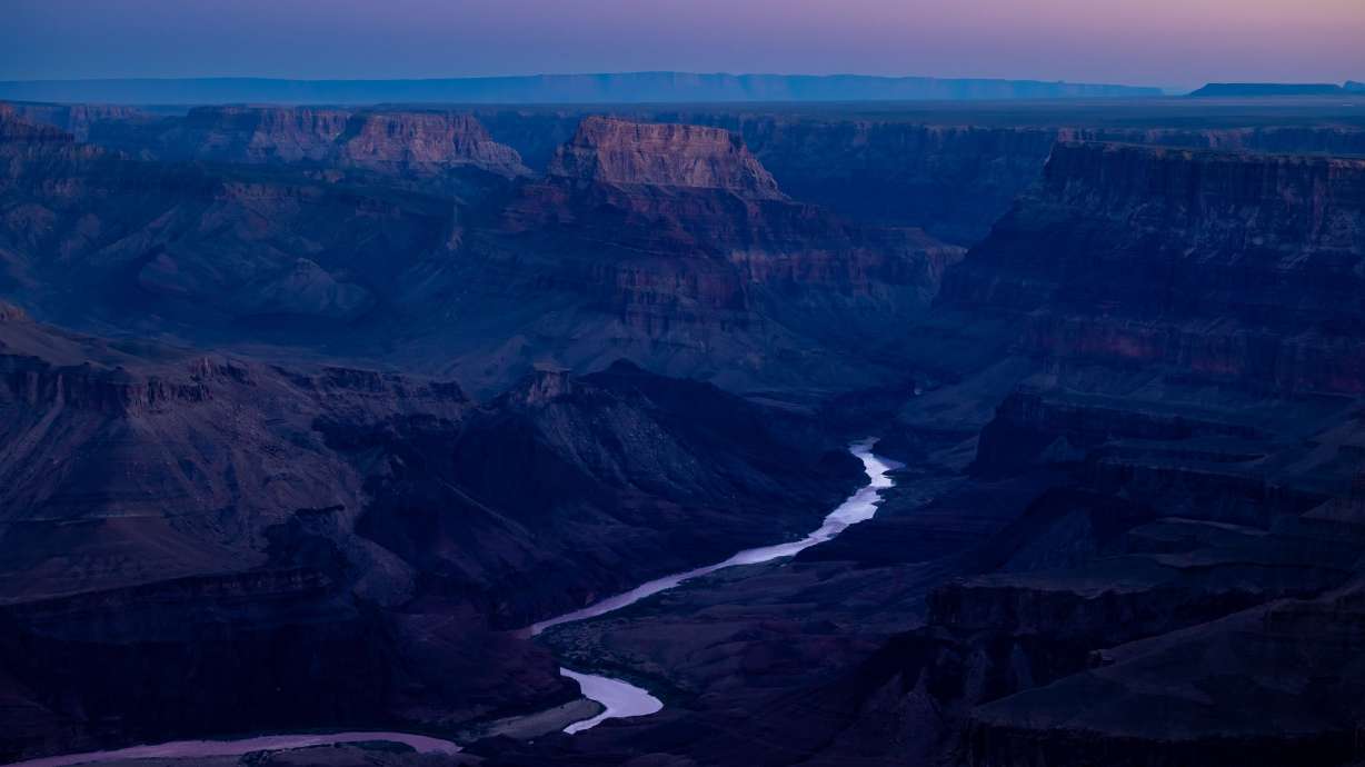 The Colorado River flows through the Grand Canyon at sunrise as seen from the south rim in Grand Canyon National Park in Arizona on Oct. 11.