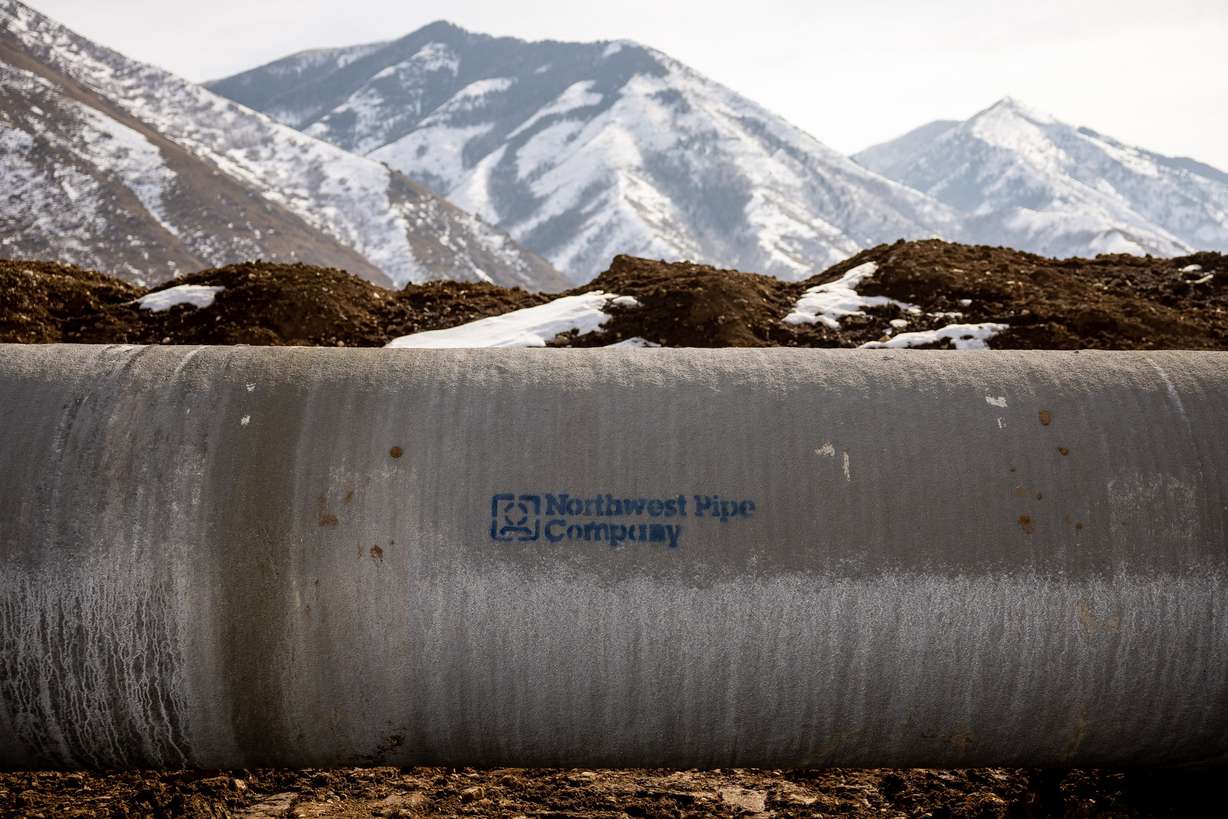 A section of 60-inch welded steel pipe waits to be buried in a trench as construction continues on the Spanish Fork Canyon – Santaquin Pipeline, a part of the Central Utah Project, in Spanish Fork on Feb. 10.