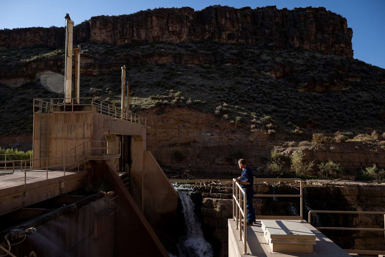 Dave Jessop, operations manager for the Washington County Water Conservancy District, poses for a photo beside the Quail Creek Diversion Dam, which diverts water from the Virgin River for agricultural and municipal use, near the town of Virgin on Sept. 8.