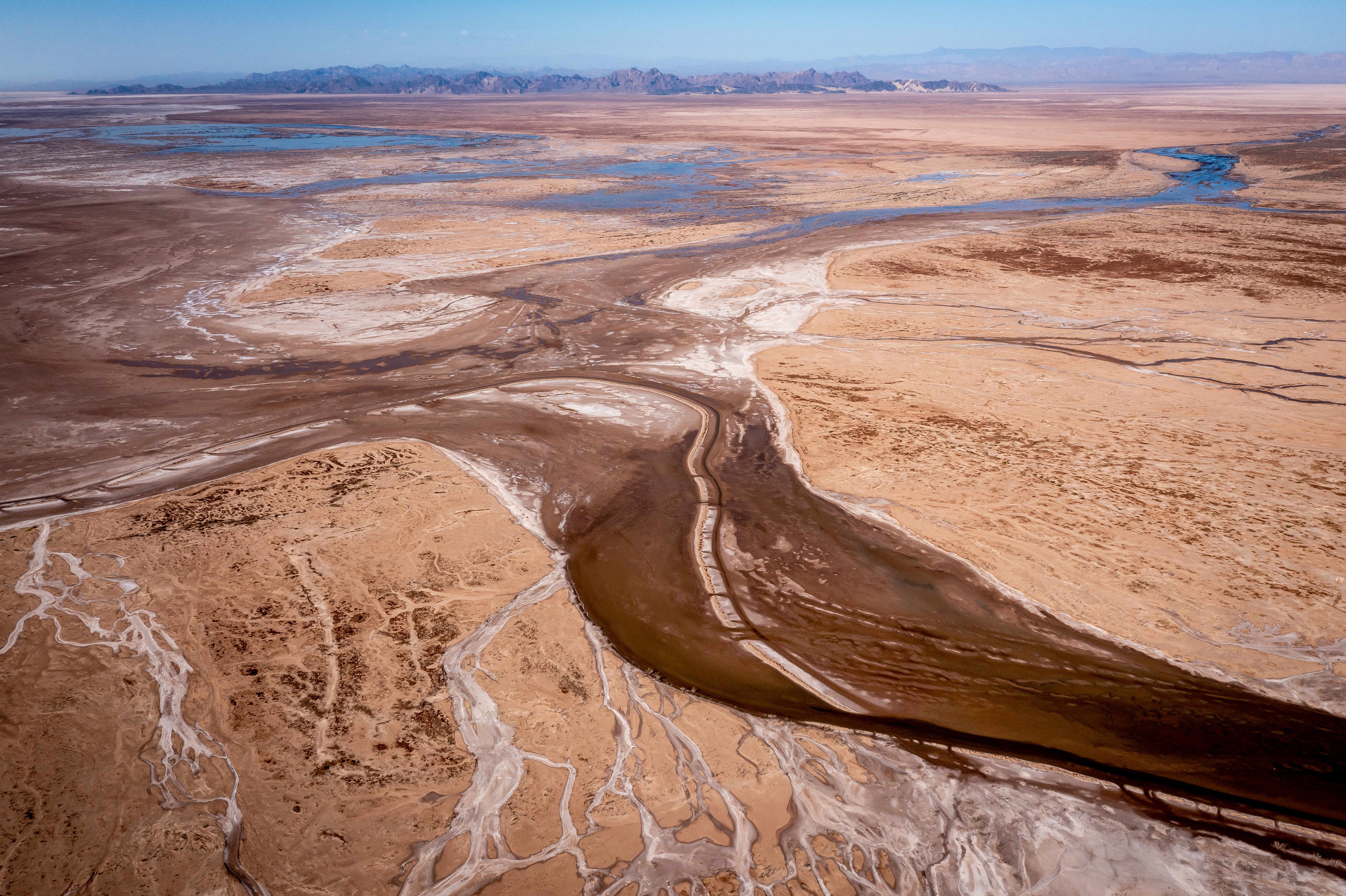 A small amount of water flows south in the Colorado River Delta in Baja California, Mexico, on June 23. Flows released into the delta under a binational agreement have allowed the river’s water to reach this far, but it only reconnects with the sea when an especially high tide comes in to meet it in the estuary.