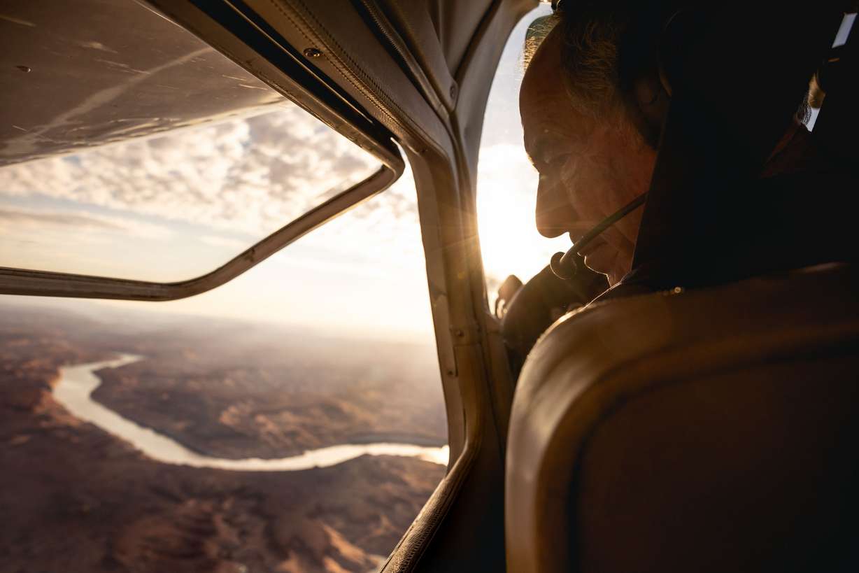 EcoFlight Executive Director Bruce Gordon pilots his airplane over the upper reaches of Lake Powell in southern Utah on July 22.