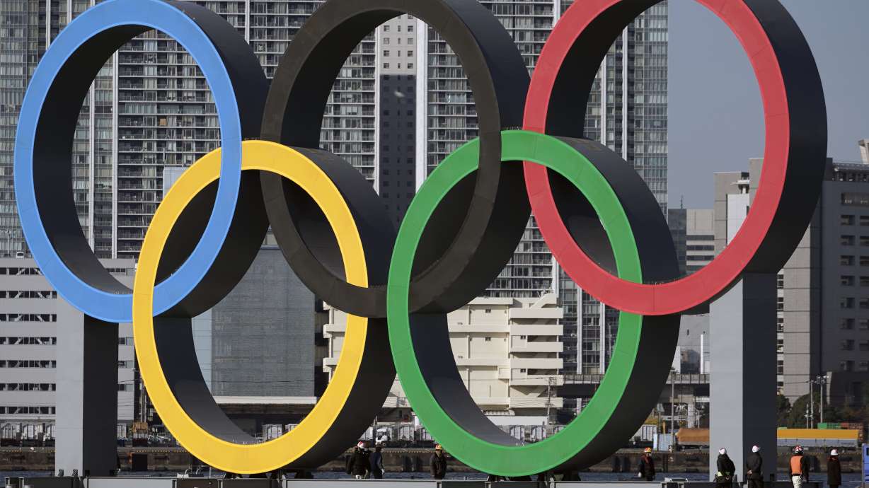 FILE - In this Dec. 1, 2020, file photo, the Olympic rings are reinstalled after it was taken down for maintenance ahead of the postponed Tokyo 2020 Olympics in the Odaiba section in Tokyo. The U.S. Olympic and Paralympic Committee is encouraging individual sports to consider “category qualifiers” — classified in some sports as “open” categories — to ensure transgender athletes will have events to participate in once they reach puberty. The USOPC finalized its two-page “position paper” at its board meeting earlier this month and released it Monday, Dec. 19, 2022, addressing a proposed path forward for transgender participation in sports.