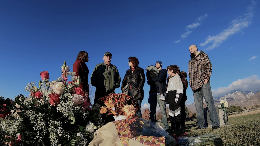 In an undated photo, the Mayne family gathered at the gravesite of Amanda Mayne who was killed by her ex-husband in August.