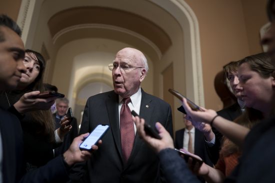 Senate Appropriations Committee Chair Patrick Leahy, D-Vt., is surrounded by reporters at the Capitol seeking updates on negotiations on the government spending package, at the Capitol in Washington, Monday.
