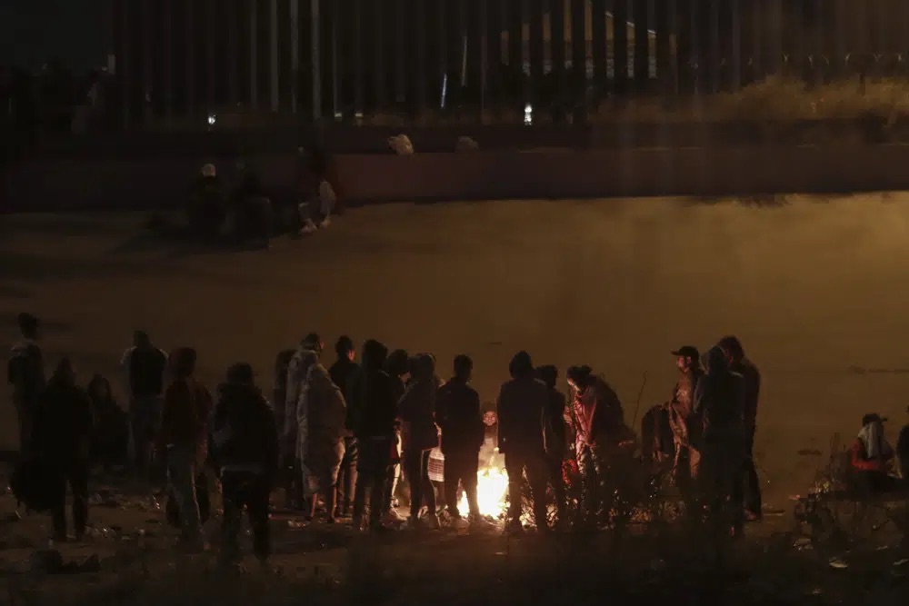 Migrants wait near the U.S.-Mexico border in Ciudad Juarez, Mexico, Monday. Pandemic-era immigration restrictions in the U.S. known as Title 42 are set to expire on Wednesday.