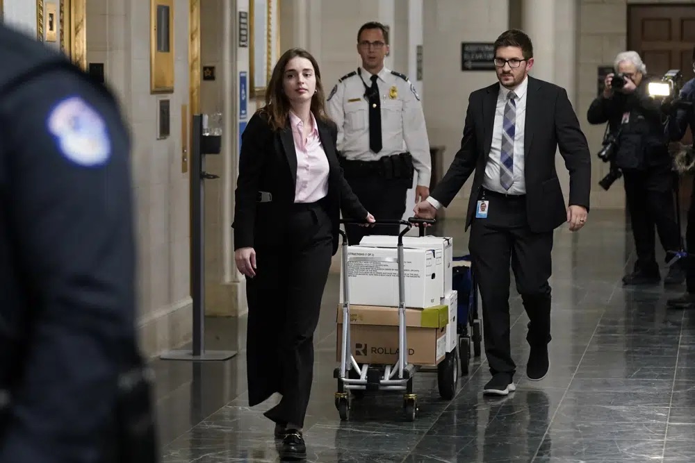Documents arrive as the House Ways & Means Committee holds a hearing regarding tax returns from former President Donald Trump on Capitol Hill in Washington, Tuesday.