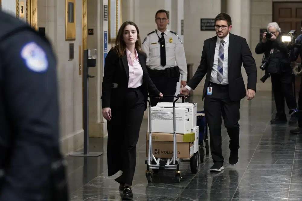 Documents arrive as the House Ways & Means Committee holds a hearing regarding tax returns from former President Donald Trump on Capitol Hill in Washington, Tuesday.