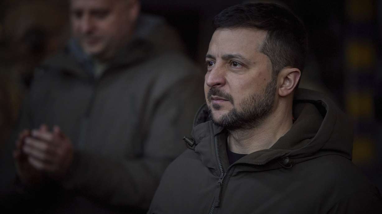 Ukrainian President Volodymyr Zelenskyy, looks on as he meets soldiers at the site of the heaviest battles with the Russian invaders in Bakhmut, Ukraine, Tuesday.
