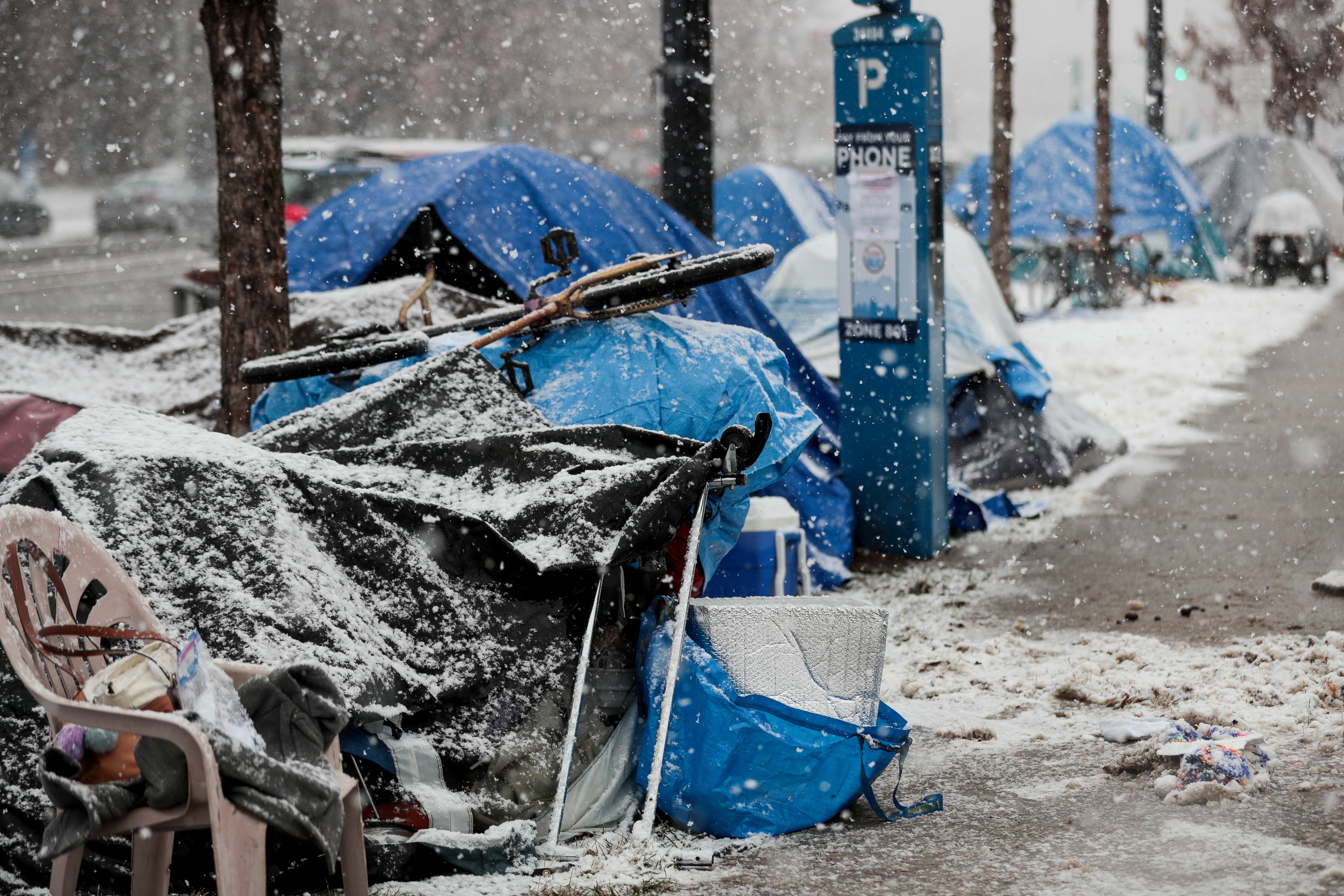 People experiencing homelessness camp at Library Square in Salt Lake City on Nov. 29, 2019. State officials have notified advocates asked to help keep homeless people off the streets during the NBA All-Star Weekend that funding for that effort will no longer be available.