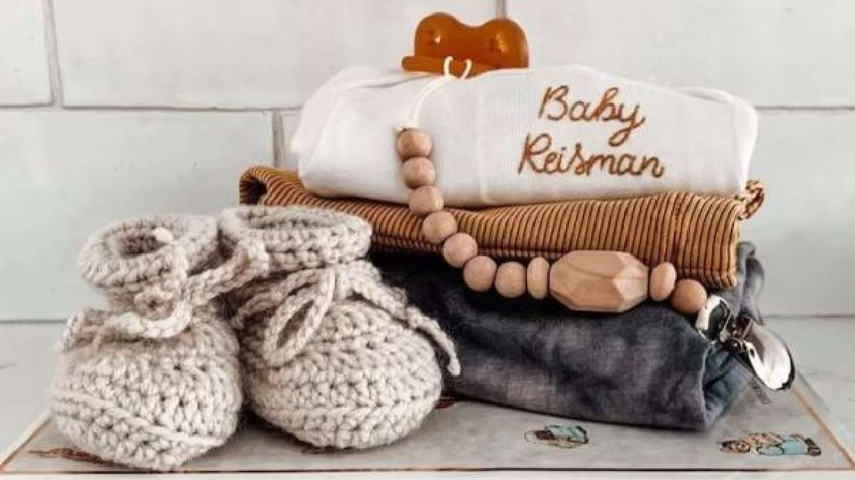 A Utah business owner has an influx of orders after one of her personalized onesies was worn by a royal baby on the "Harry & Meghan" Netflix series.