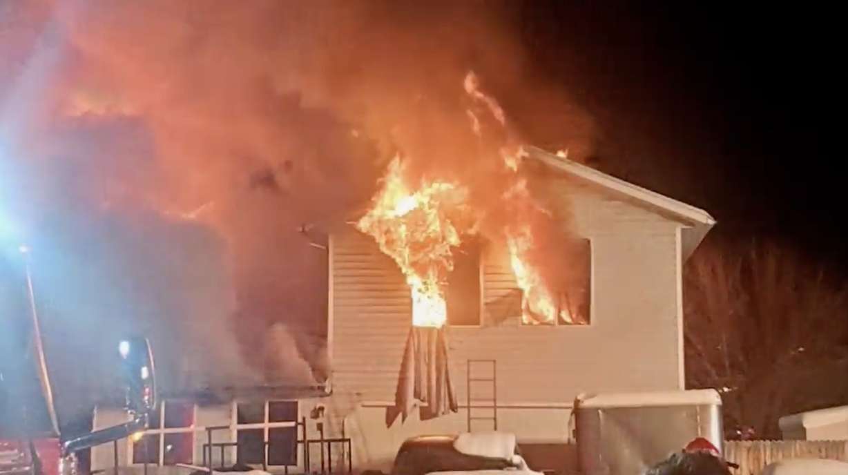 Several neighbors are being credited for helping to save the lives of a Taylorsville family after their home went up in flames Monday night.