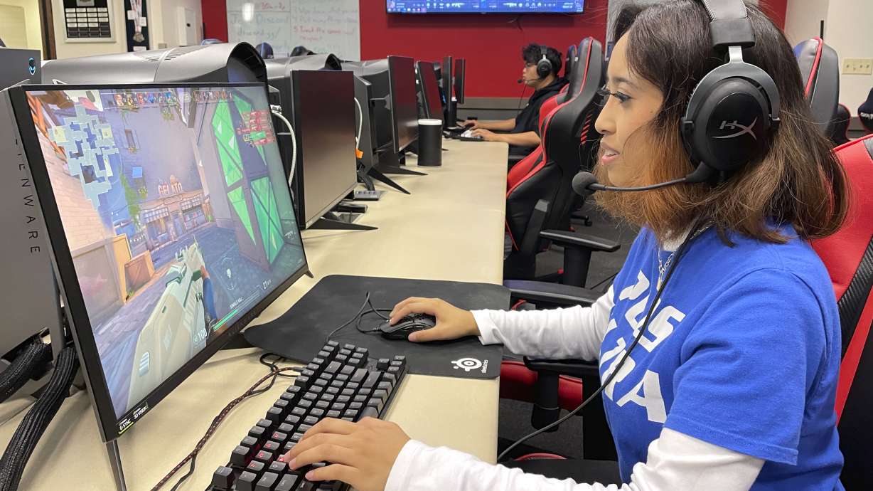 Lethrese Rosete, a 20-year-old DePaul sophomore who is majoring in UX design to combine her creativity and coding skills, plays an online game at the university's Esports Gaming Center Thursday, Sept. 22, 2022, in Chicago. A growing effort to channel students' enthusiasm for esports toward preparing them for jobs in science, technology, engineering and math could improve racial diversity in STEM.