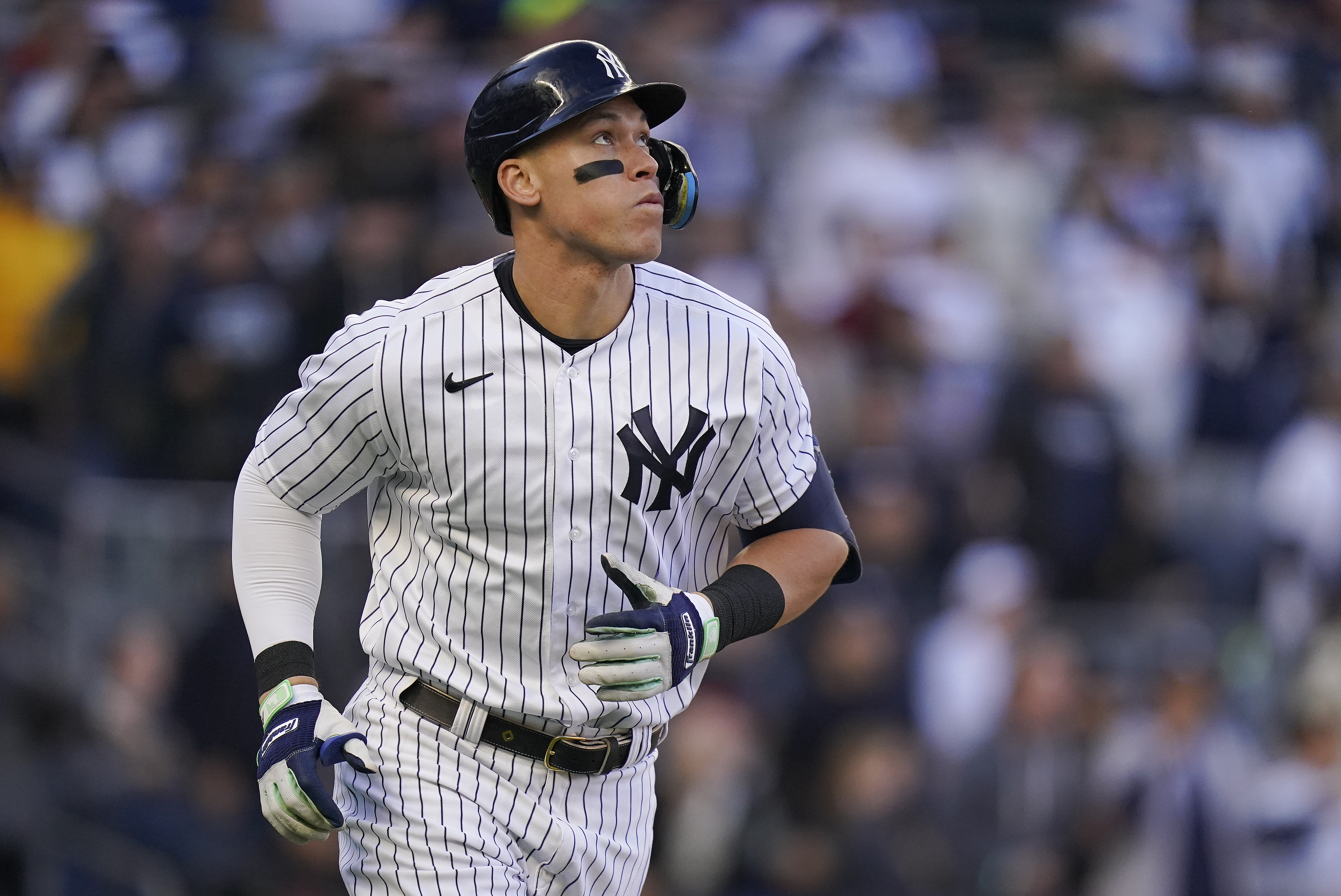 New York Yankees' Aaron Judge watches his solo home run ball during the second inning of Game 5 of an American League Division baseball series against the Cleveland Guardians, Oct. 18, 2022, in New York. Judge has agreed to return to the Yankees on a $360 million, nine-year contract, according to a person familiar with the deal. The person spoke to The Associated Press on Wednesday, Dec. 7, 2022 because the deal had not been announced.
