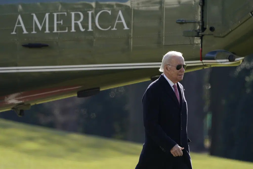 President Joe Biden walks on the South Lawn of the White House after stepping off Marine One, Monday. Millions of people who enrolled in Medicaid during the COVID-19 pandemic could start to lose their insurance plans by April 1 if Congress passes the $1.7 trillion spending package leaders unveiled Tuesday.