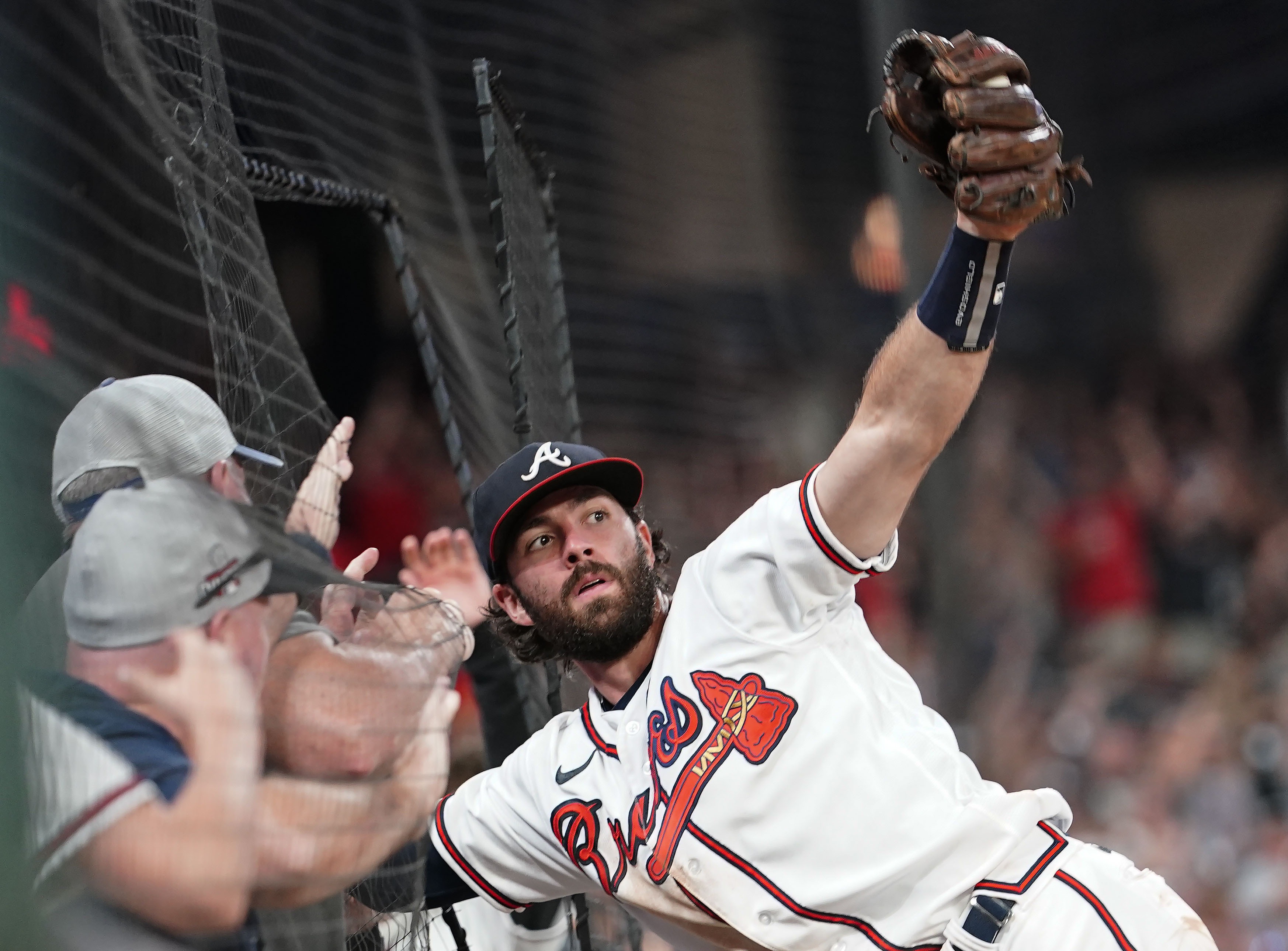 FILE - Atlanta Braves' Dansby Swanson (7) catches a ball hit by Philadelphia Phillies' Kyle Schwarber in the ninth inning of a baseball game Sept. 17, 2022, in Atlanta. The Chicago Cubs and Swanson agreed to a seven-year, $177 million contract on Saturday, Dec. 17, 2022, adding the All-Star shortstop to their rebuilding project. The deal includes a full no-trade clause, according to a person familiar with the negotiations who spoke to the AP on condition of anonymity because the contract was pending a physical. 