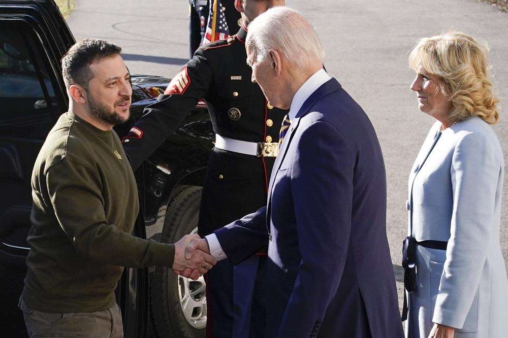 President Joe Biden shakes hands with Ukrainian President Volodymyr Zelenskyy as he welcomes him to the White House, Wednesday in Washington. First lady Jill Biden is at right.