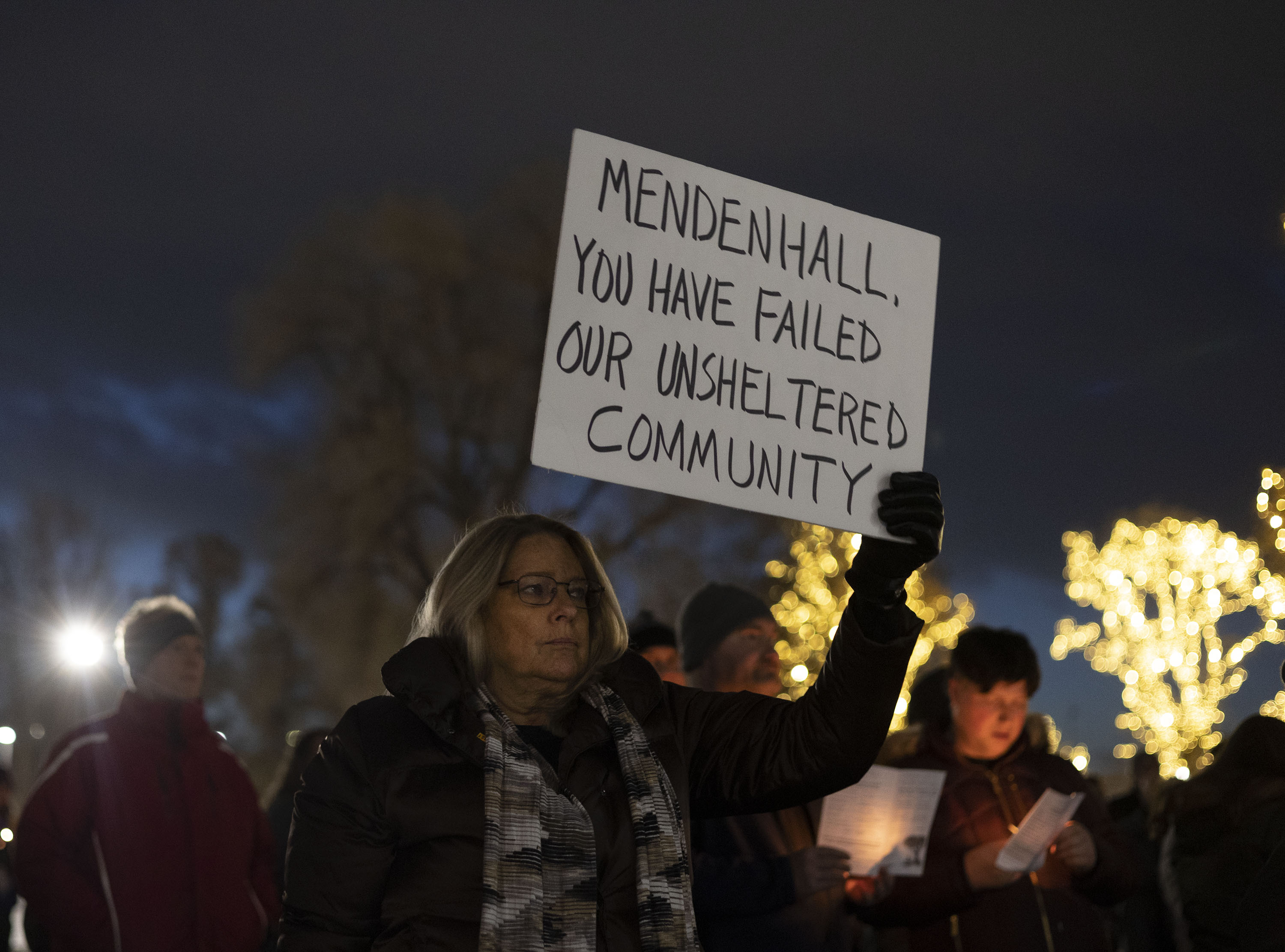 Cynda Nygaard attends the annual candlelight vigil honoring those who died while homeless this year at Pioneer Park in Salt Lake City on Wednesday. At least 159 people who were homeless in Utah died in 2022.
