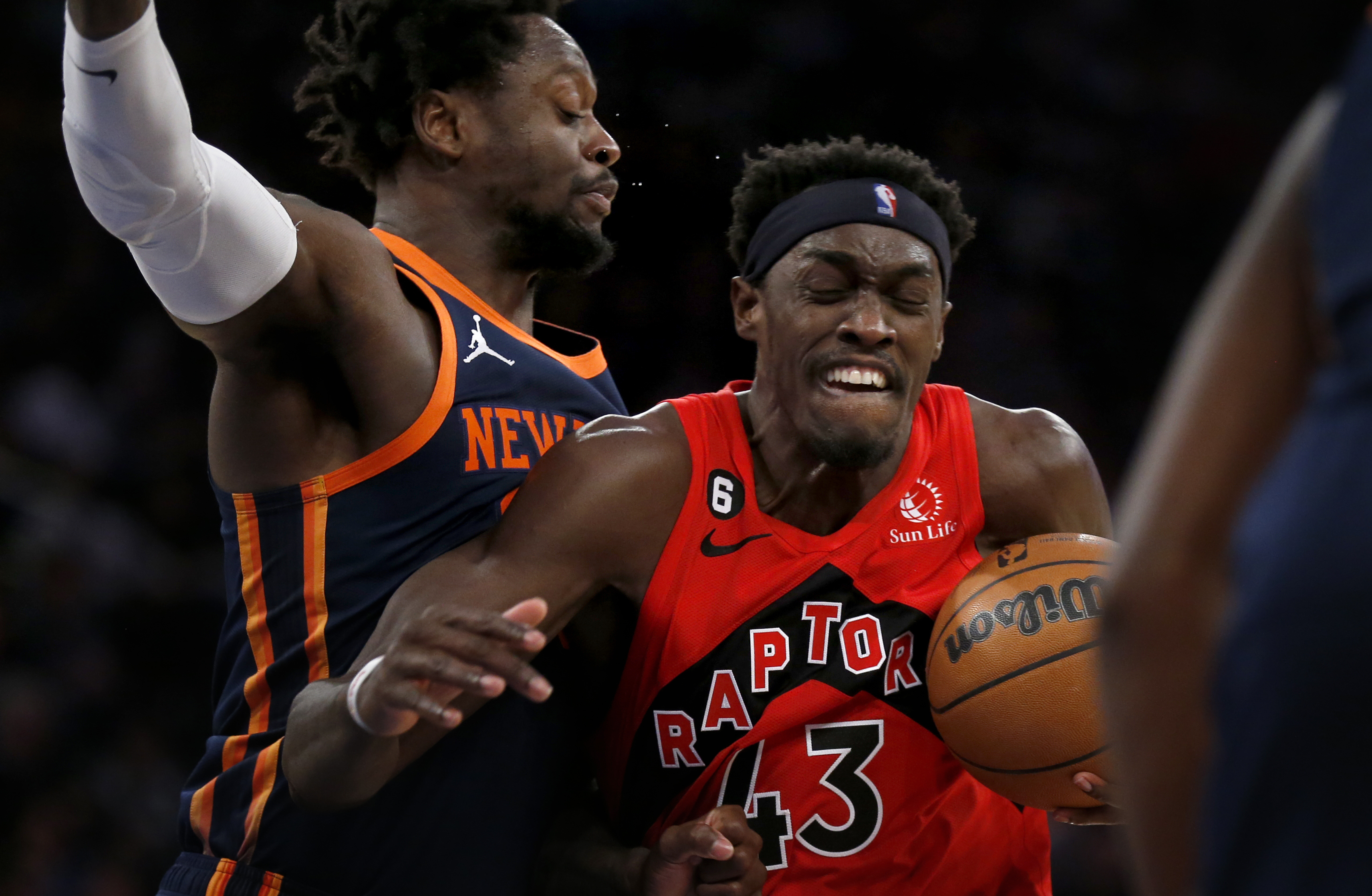 Toronto Raptors forward Pascal Siakam (43) drives past New York Knicks forward Julius Randle, left, during the first half of an NBA basketball game Wednesday, Dec. 21, 2022, in New York. 