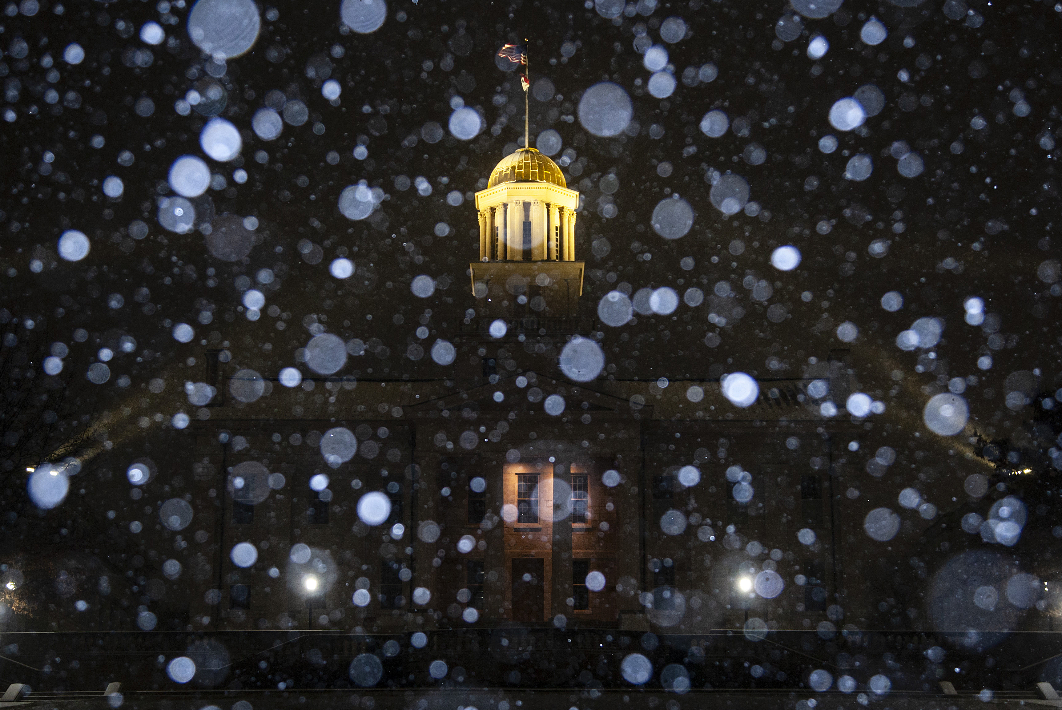 Snow falls during a blizzard warning Dec. 21, at the Old Capitol Building in Iowa City, Iowa.