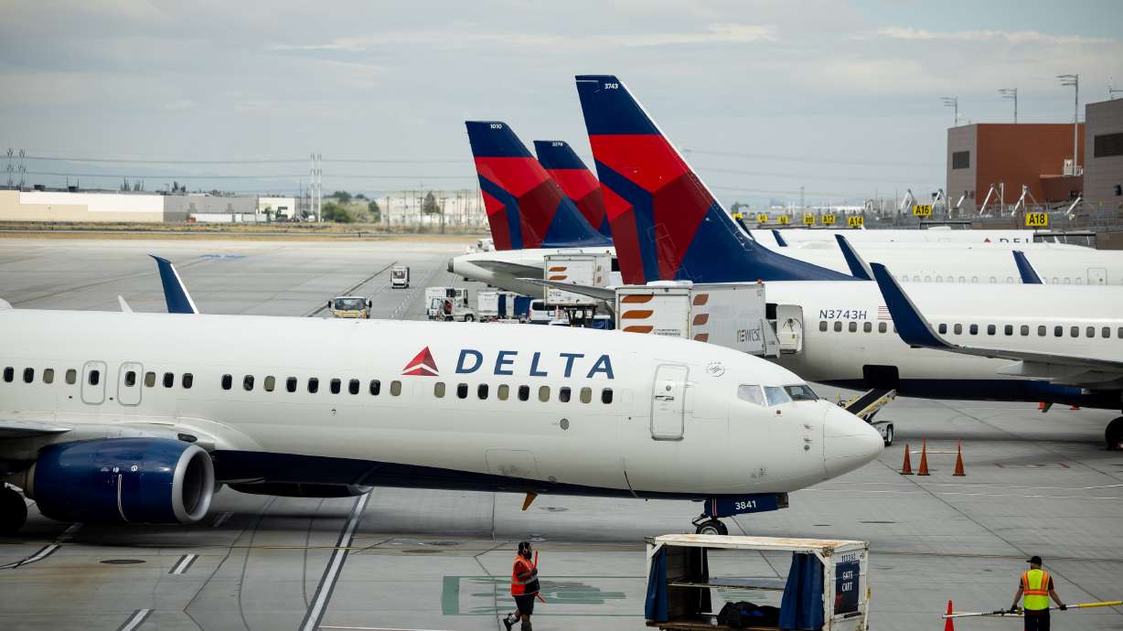 A Delta jet at the Salt Lake City International Airport Aug. 2, 2022. Utah Rep. Burgess Owens is sponsoring an amendment to allow more long-distance flights into Washington, D.C.