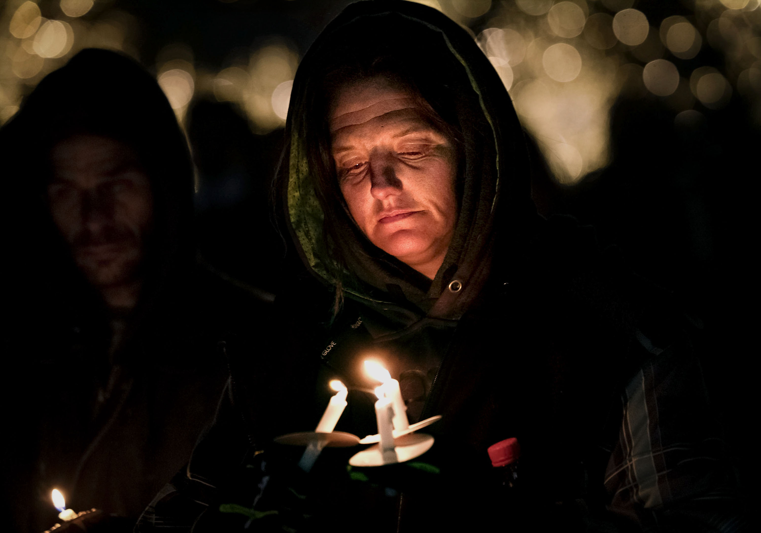 JoAnne Johanson, whose children both died while experiencing homelessness, attends the annual candlelight vigil honoring those who died while homeless this year at Pioneer Park in Salt Lake City on Wednesday. At least 159 people who were homeless in Utah died in 2022.