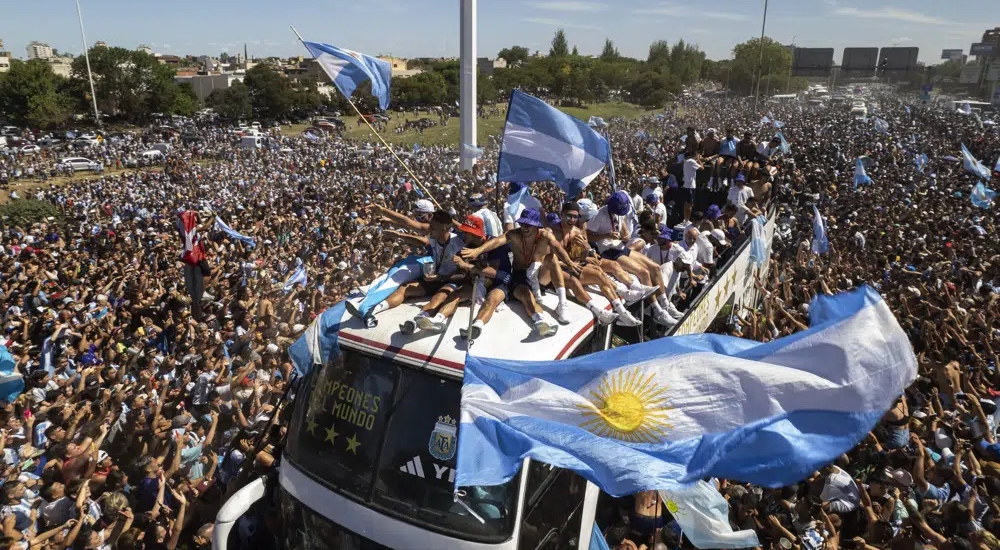 The Argentina national team parades through Buenos Aires as millions of fans took to the streets to celebrate the country's World Cup win. 