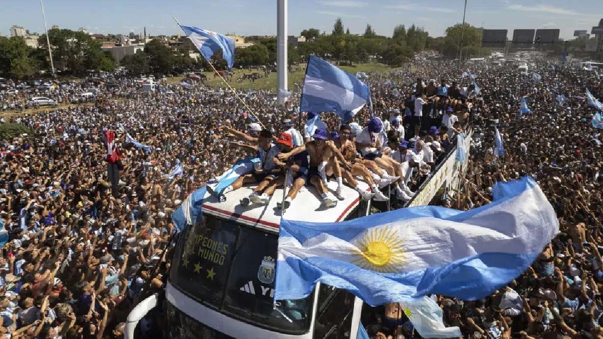 The Argentina national team parades through Buenos Aires as millions of fans took to the streets to celebrate the country's World Cup win.