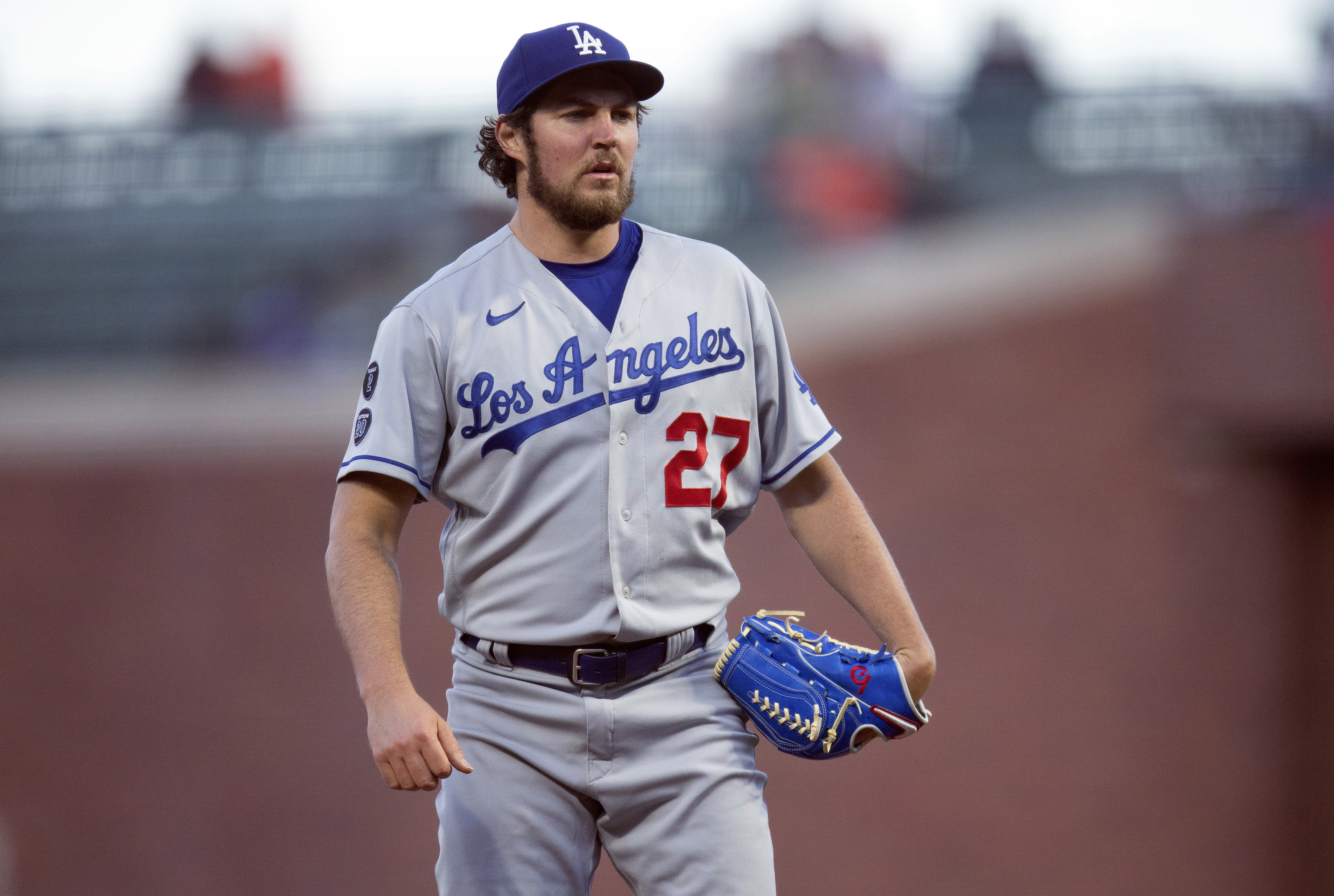 FILE - Los Angeles Dodgers starting pitcher Trevor Bauer pauses while working against the San Francisco Giants during the fourth inning of a baseball game May 21, 2021, in San Francisco. Bauer was reinstated Thursday, Dec. 22, 2022, by Major League Baseball's independent arbitrator, allowing the pitcher to resume his career at the start of the 2023 season. 