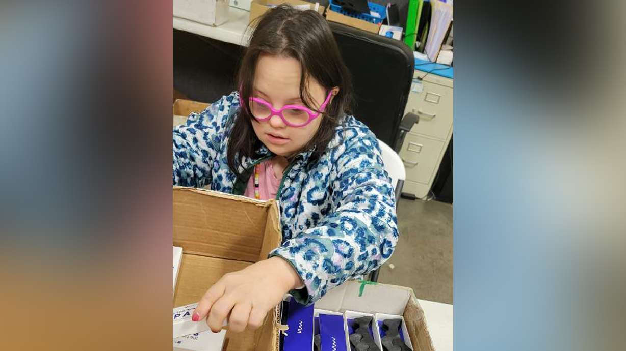 Emily Bennett packages products at South Valley Training Company. She works under a 14(c) contract, which allows her employer to pay her below minimum wage due to her disabilities.