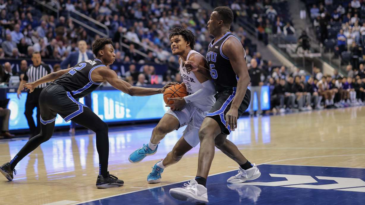 Weber State forward Dillon Jones drives into the lane against BYU in a game the Wildcats lost on Dec. 22, 2022.
