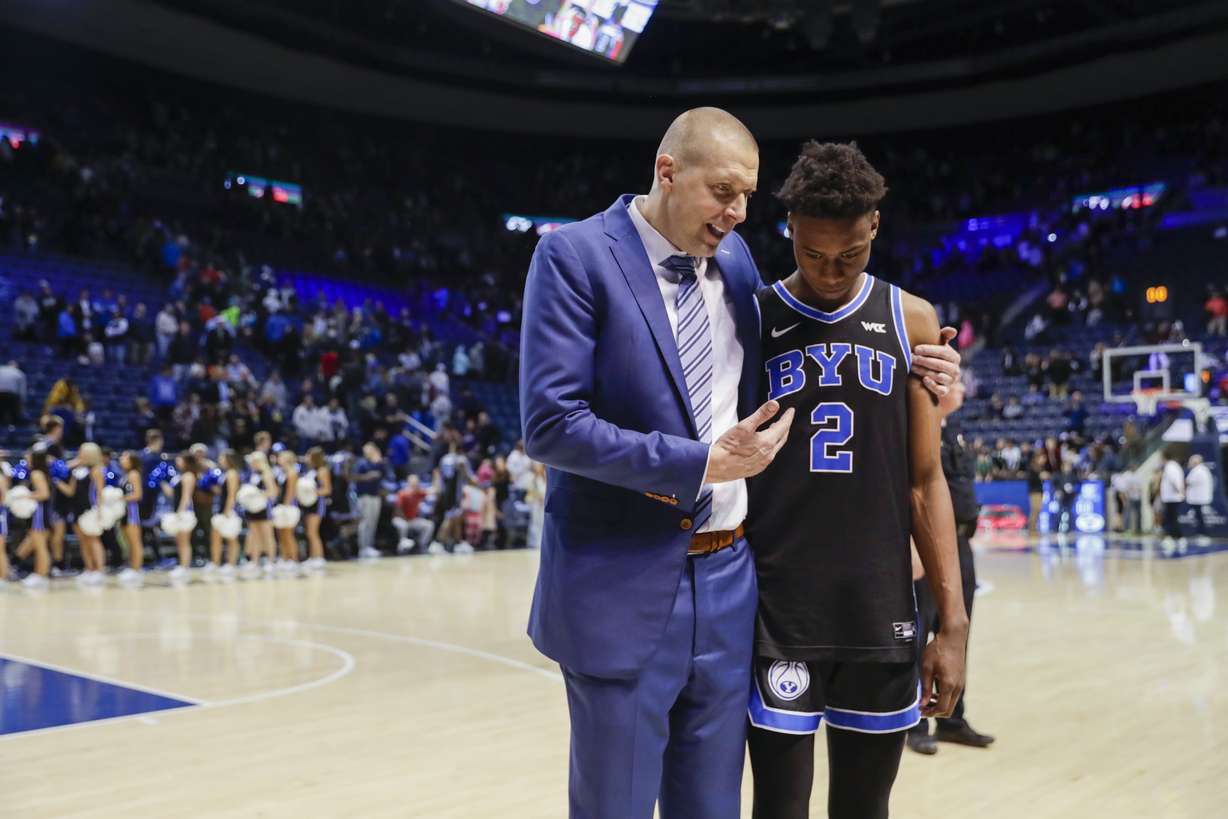 BYU head coach Mark Pope talks to Jaxson Robinson after beating the Weber State Wildcats in Provo on Thursday, Dec. 22, 2022. BYU won 63-57.